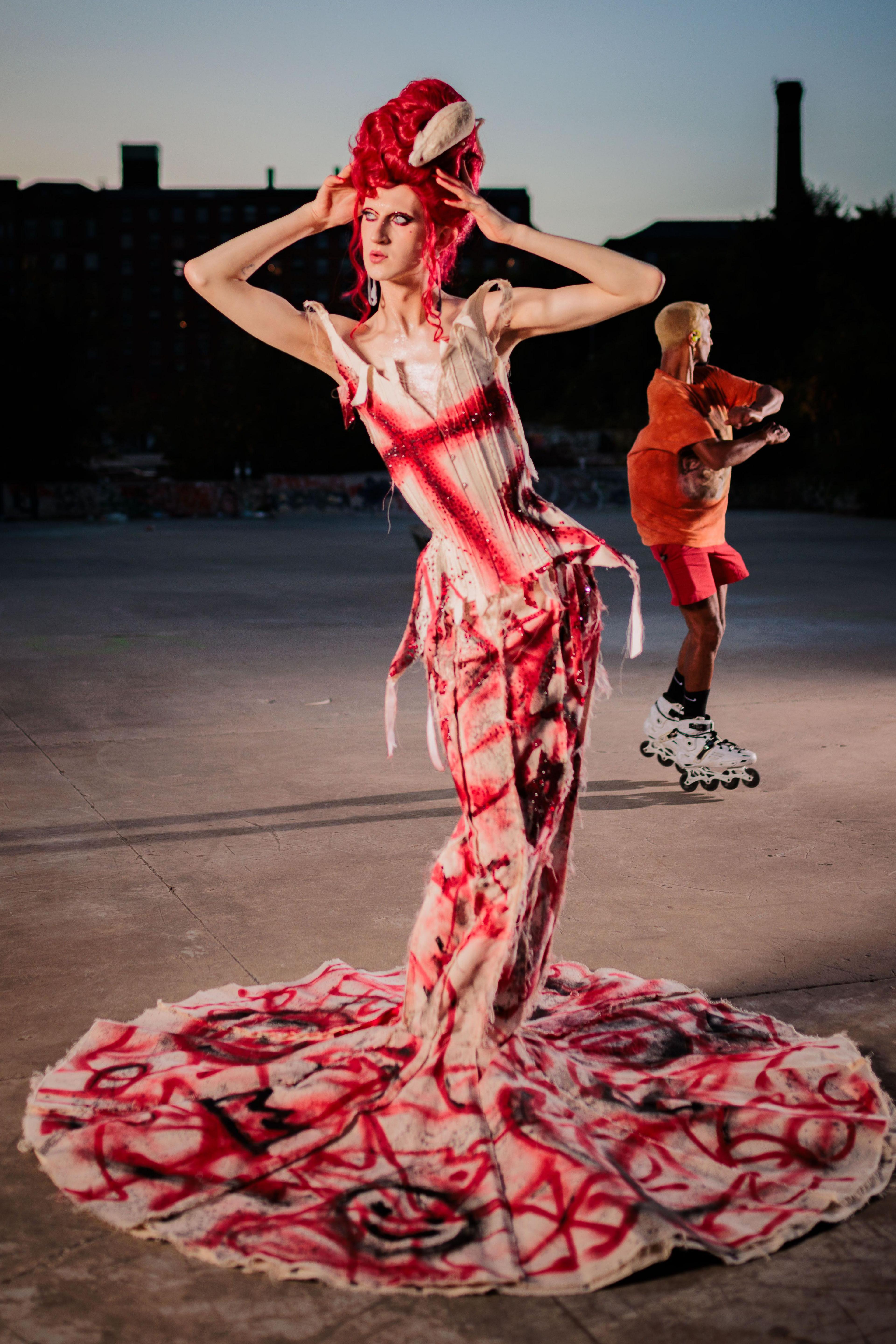 Banksie dressed up in a red and white gown