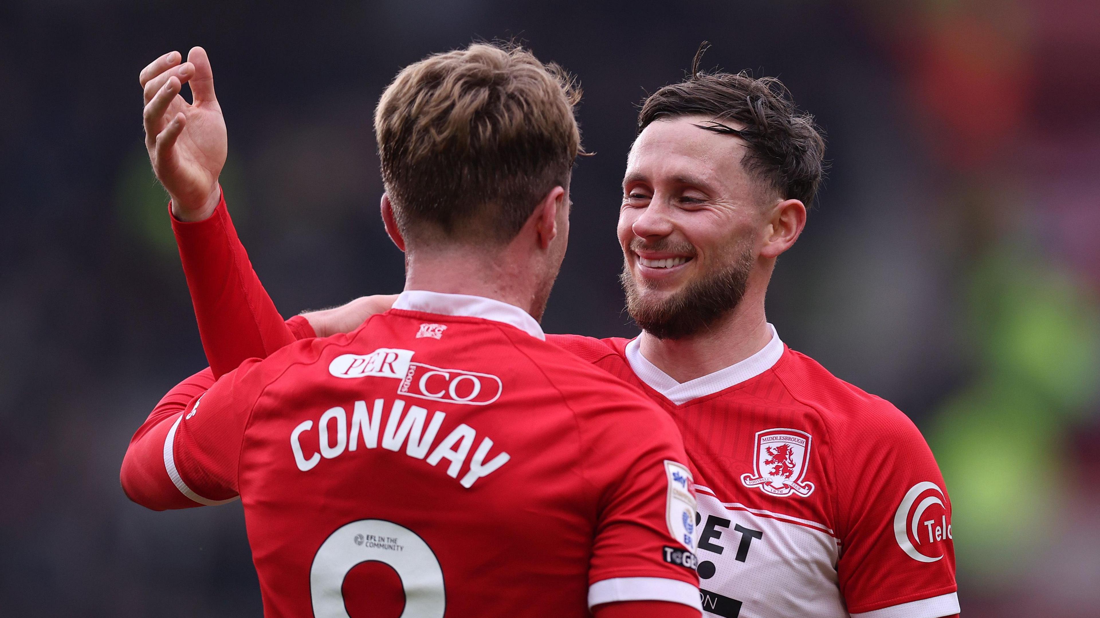 Tommy Conway wearing 'CONWAY 9' congratulates Alan Browne after Browne scores against his old club 