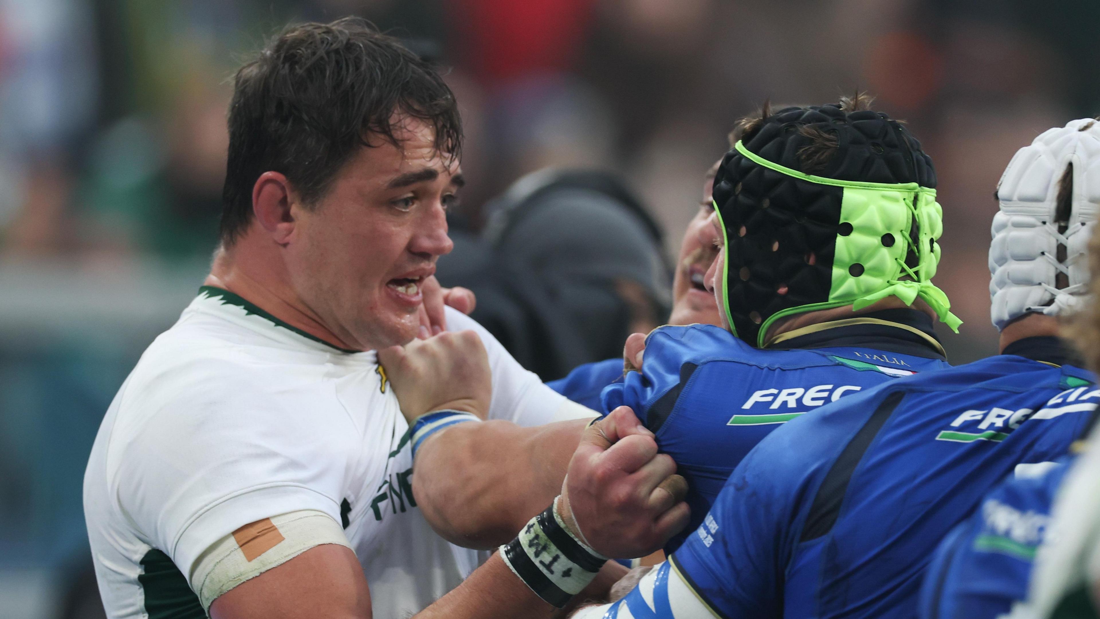 Franco Mostert is confronted by Italian players 
