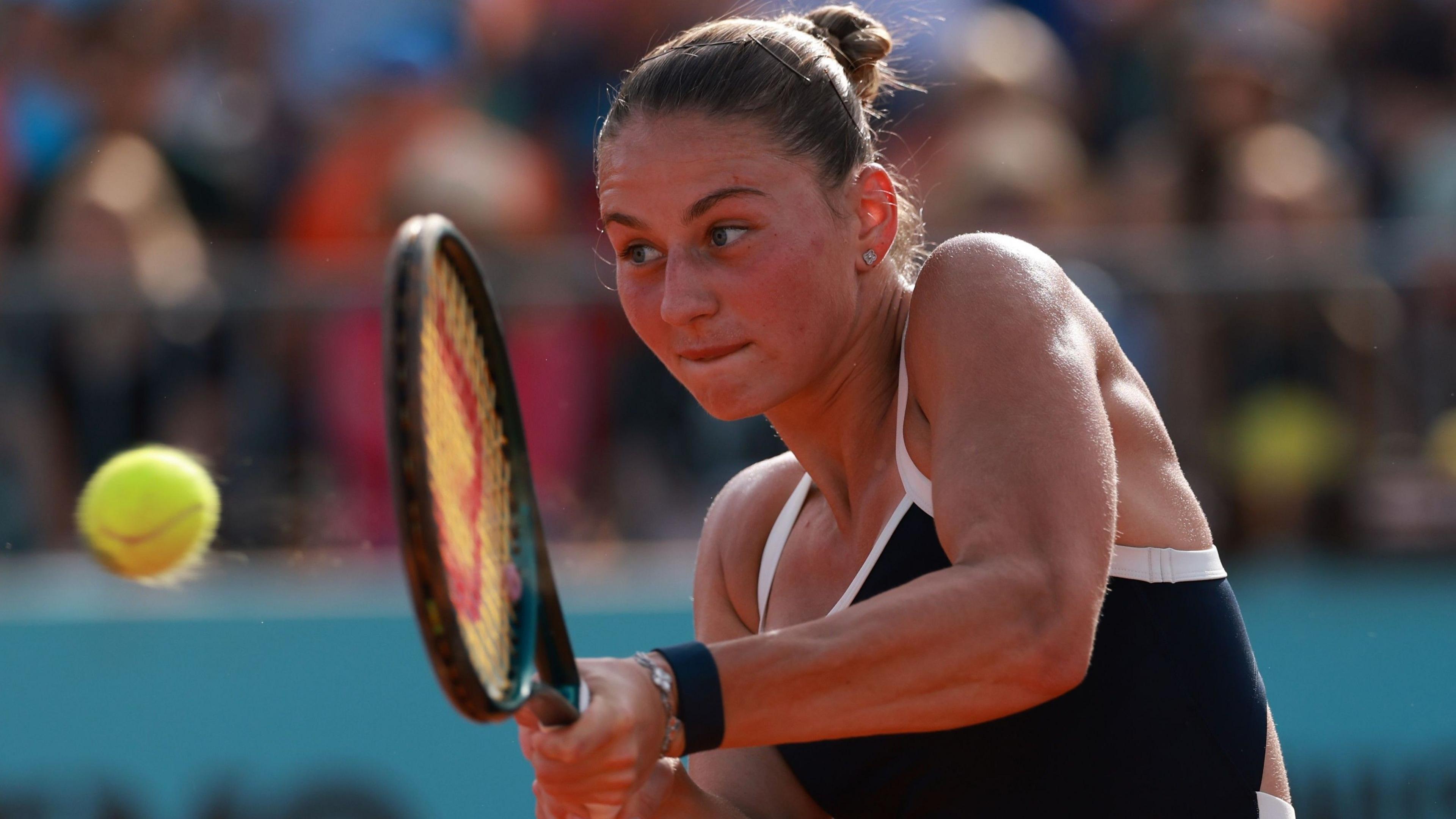 Marta Kostyuk hits the ball during her third-round match at the Madrid Open
