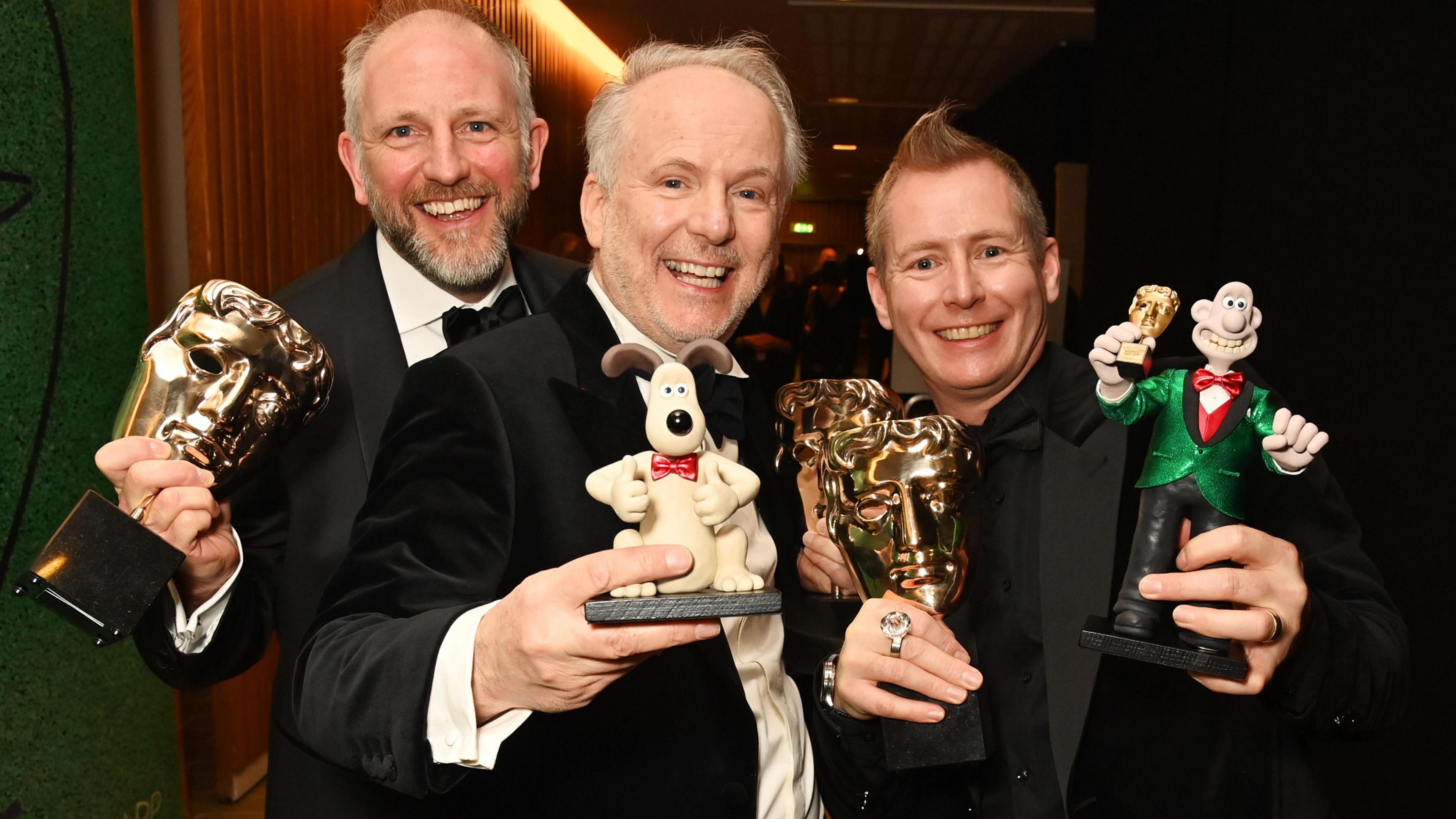 Richard Beek, Nick Park and Merlin Crossingham, winner of Best Animated Film for "Wallace and Gromit: Vengeance Most Fowl", pose backstage during the EE BAFTA Film Awards 2025 at The Royal Festival Hall on February 16, 2025 in London, England