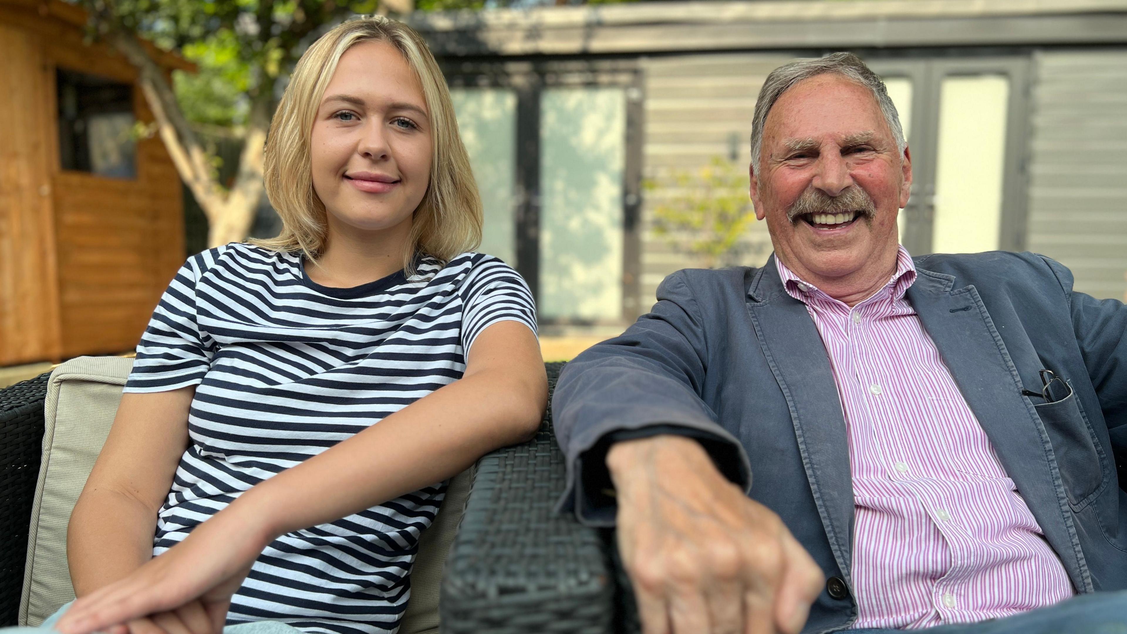 Young and old councillor sitting side by side