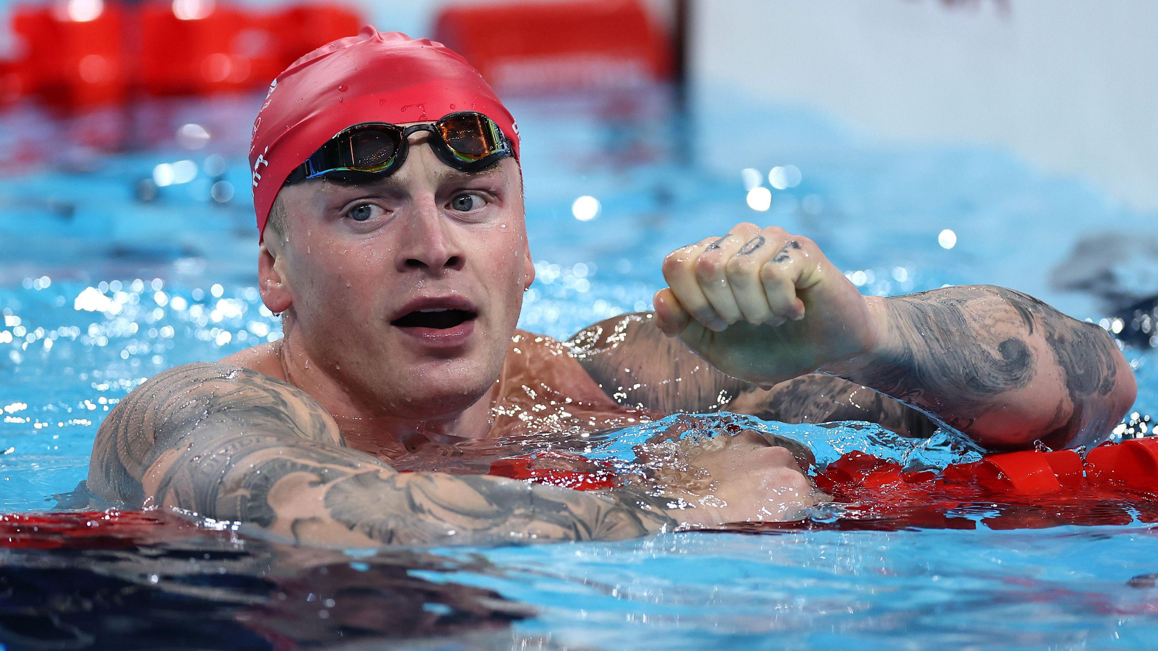 Adam Peaty at the end of a race