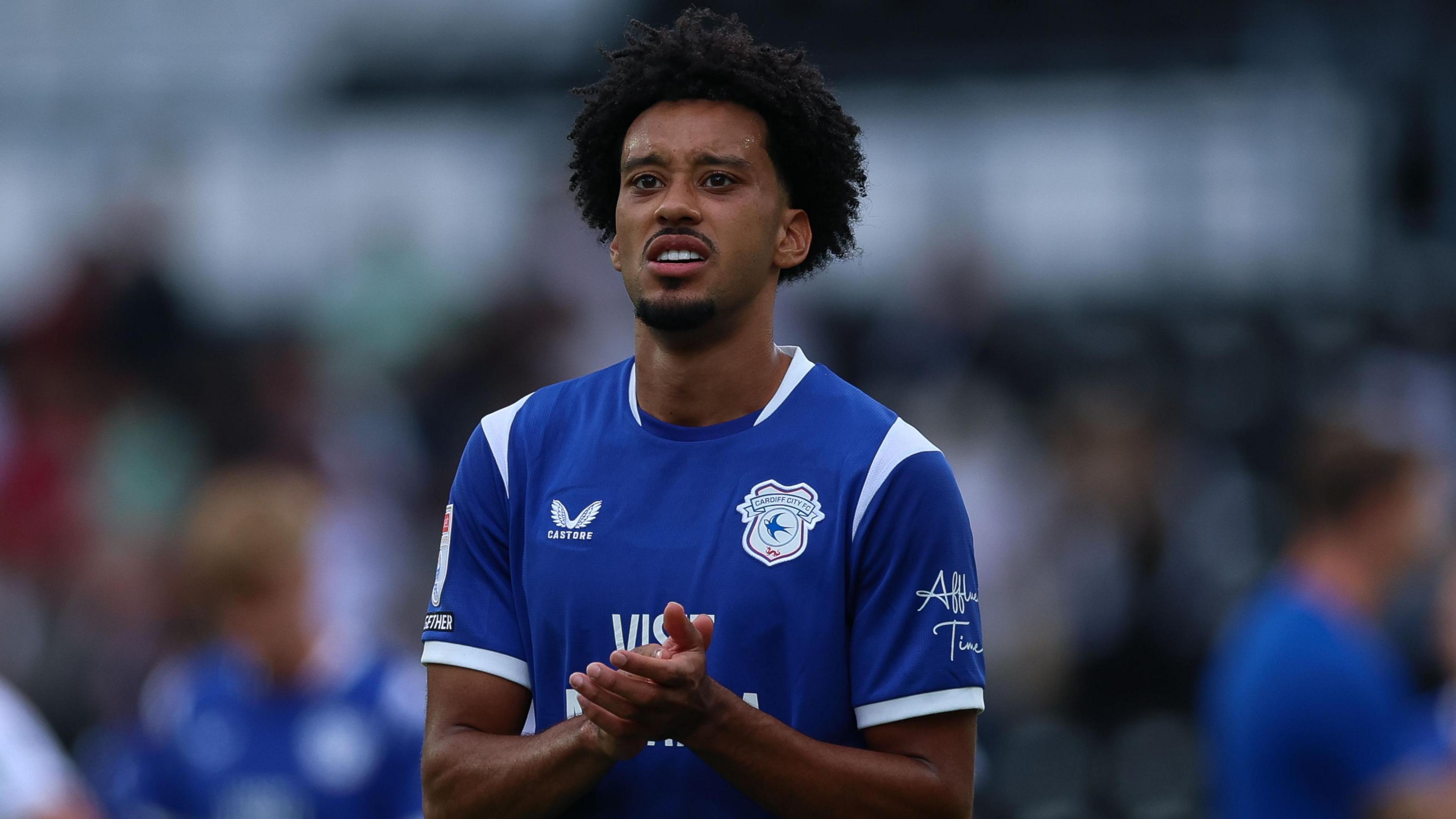 Calum Scanlon applauds after Cardiff's draw at Derby