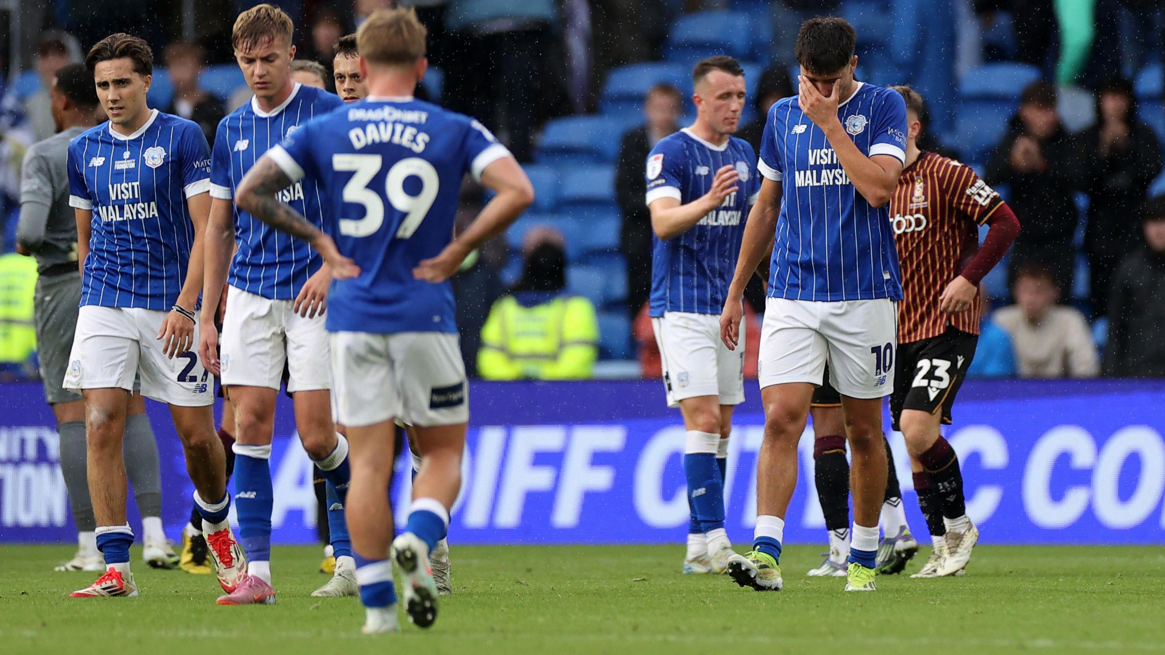 Cardiff City players looking dejected after defeat against Bradford City