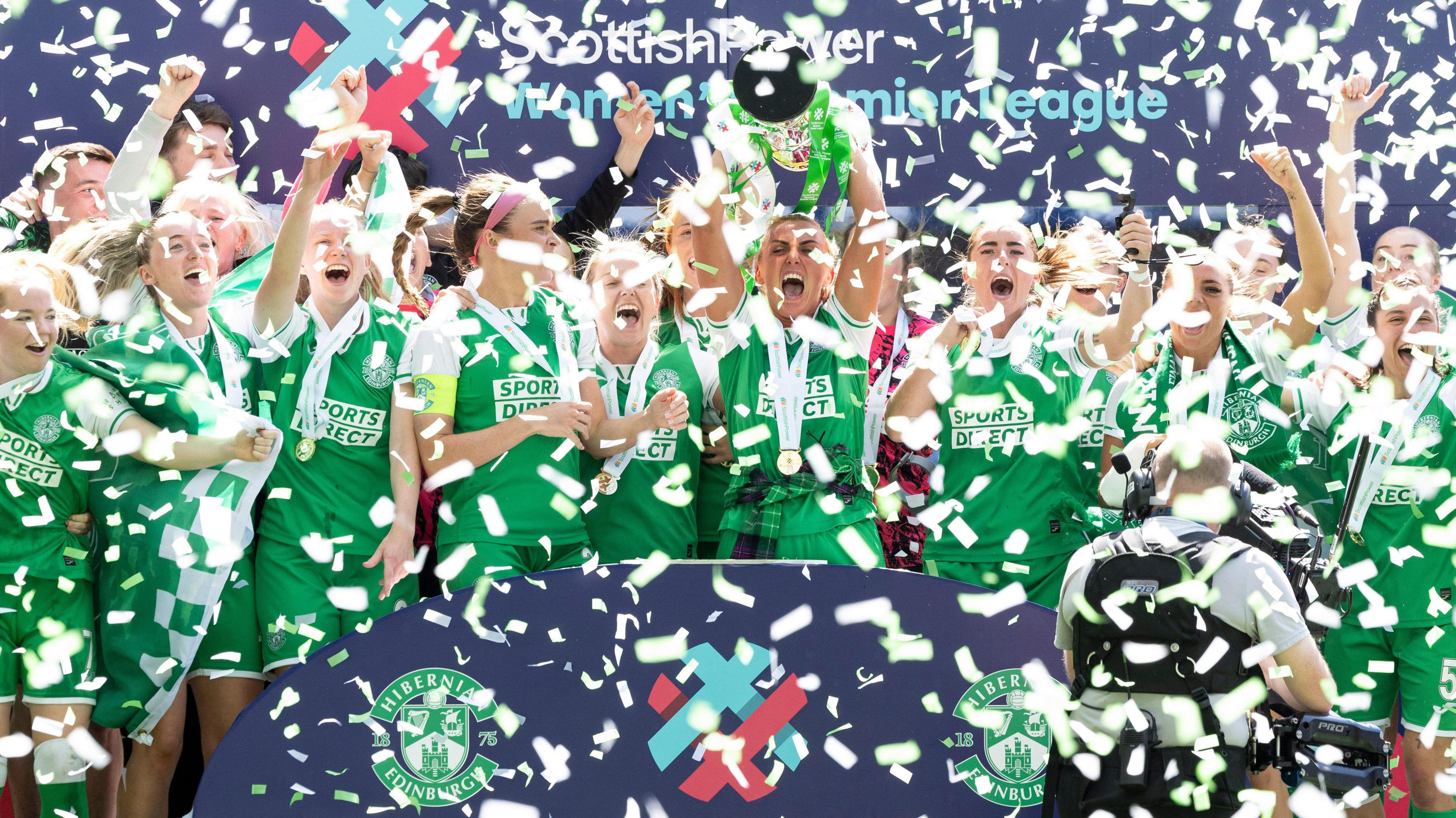 Hibernian players celebrate with the SWPL trophy