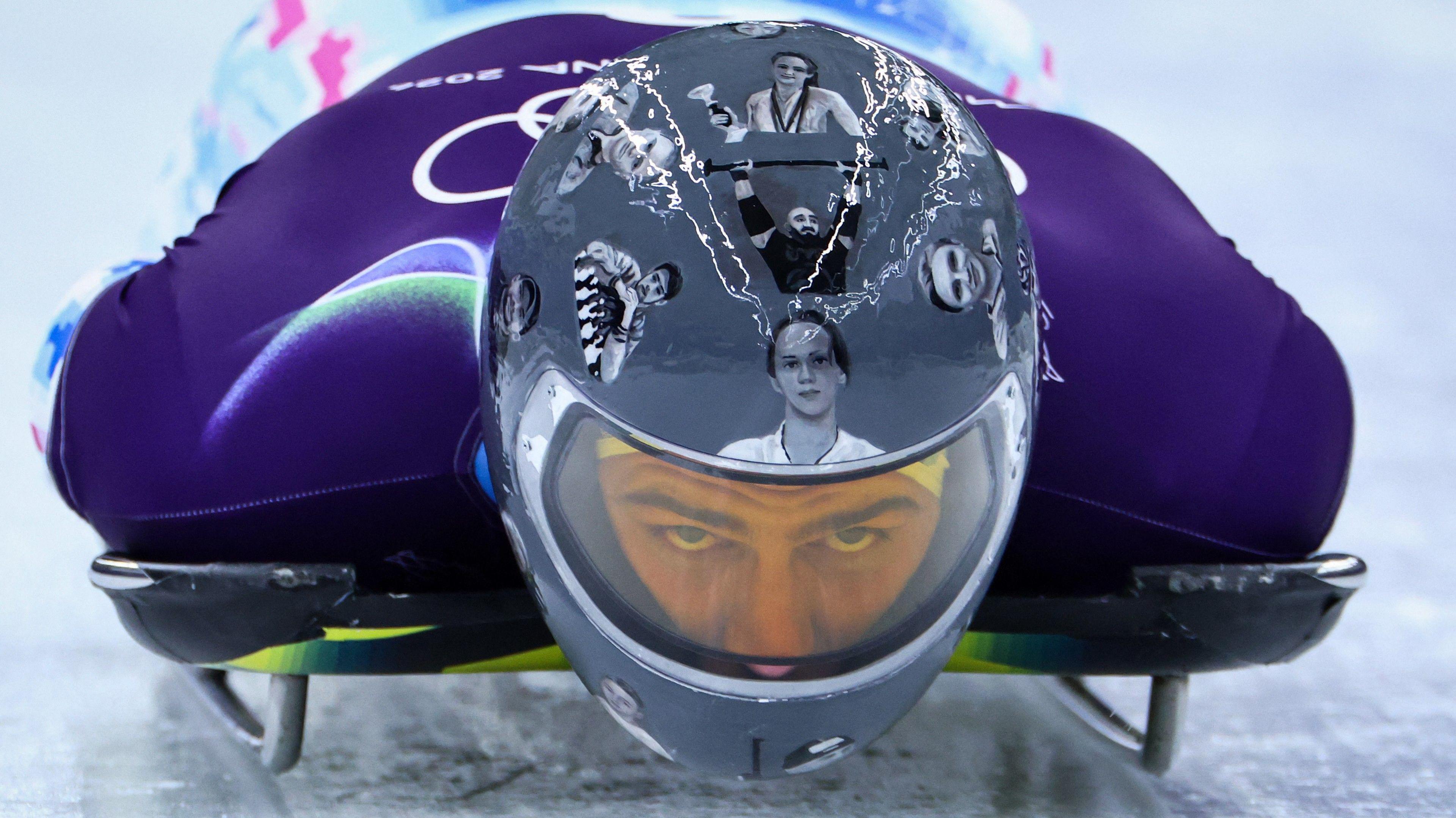 Vladyslav Heraskevych: Ukraine skeleton racer wears helmet despite IOC ban - BBC Sport