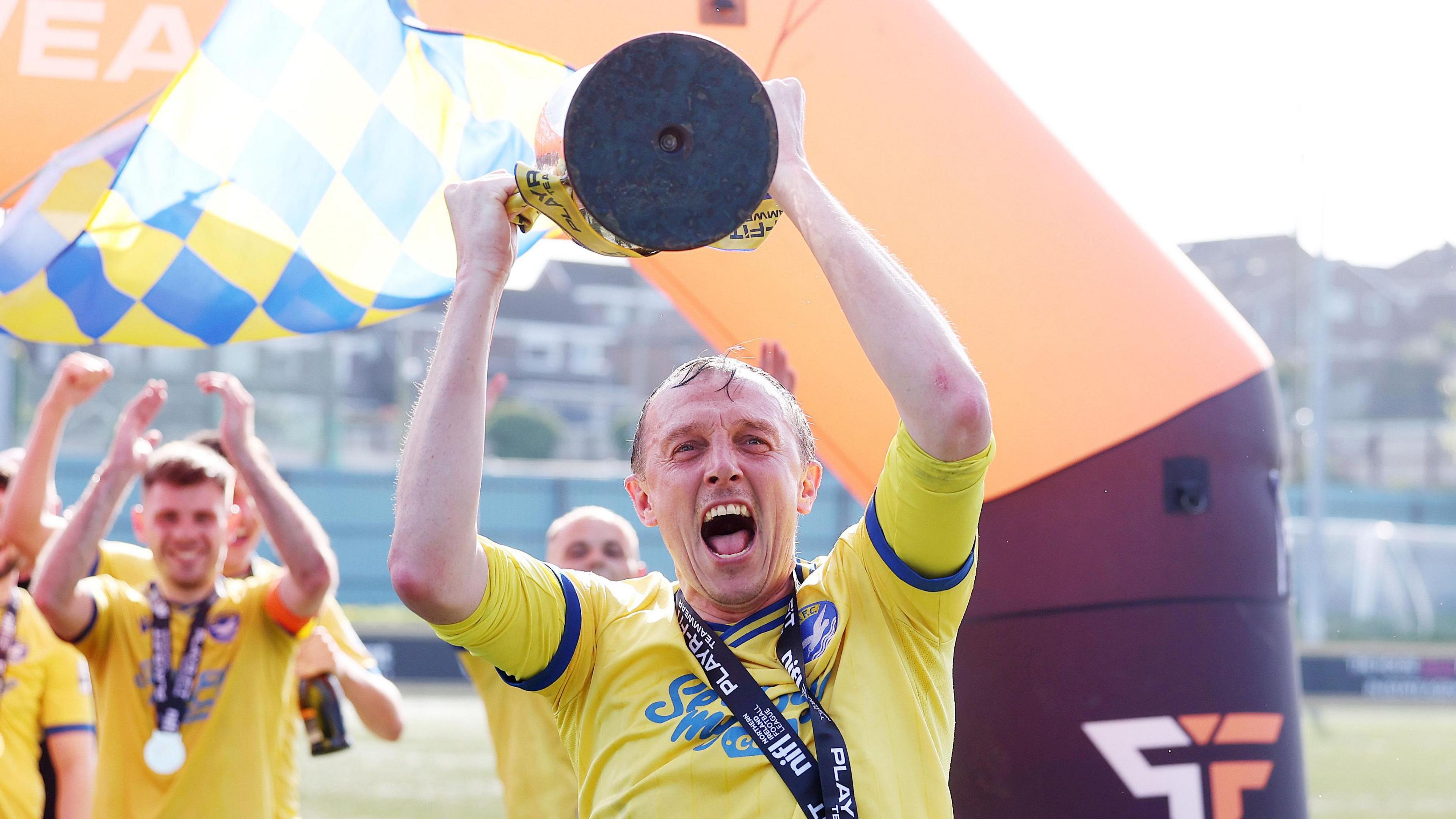 Michael Halliday lifts trophy