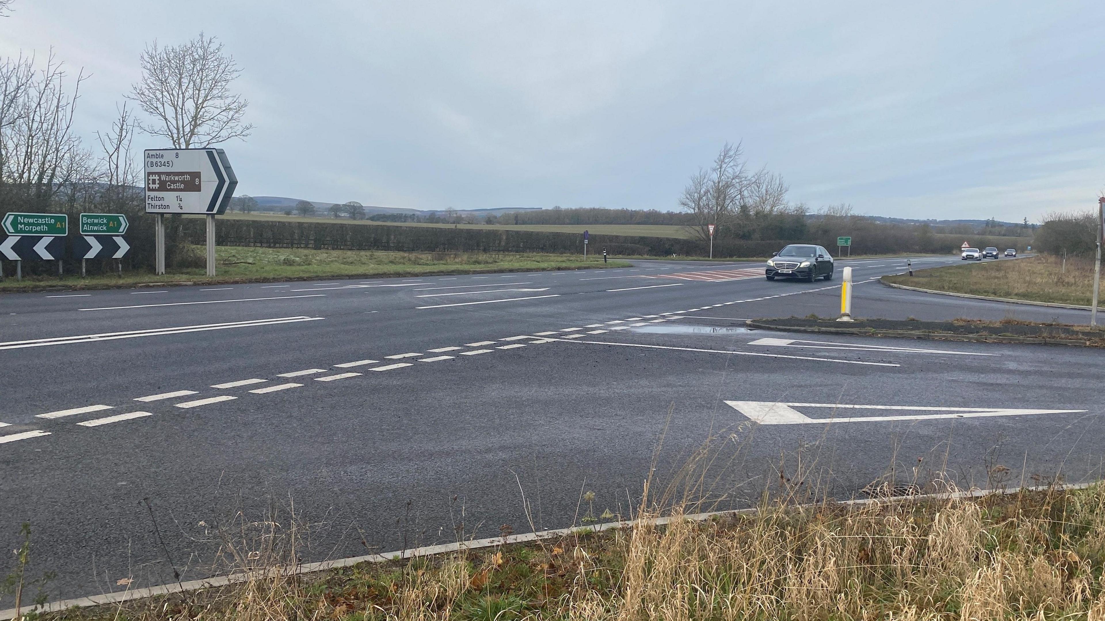 A junction of the A1 with a large sign pointing to Felton and Amble