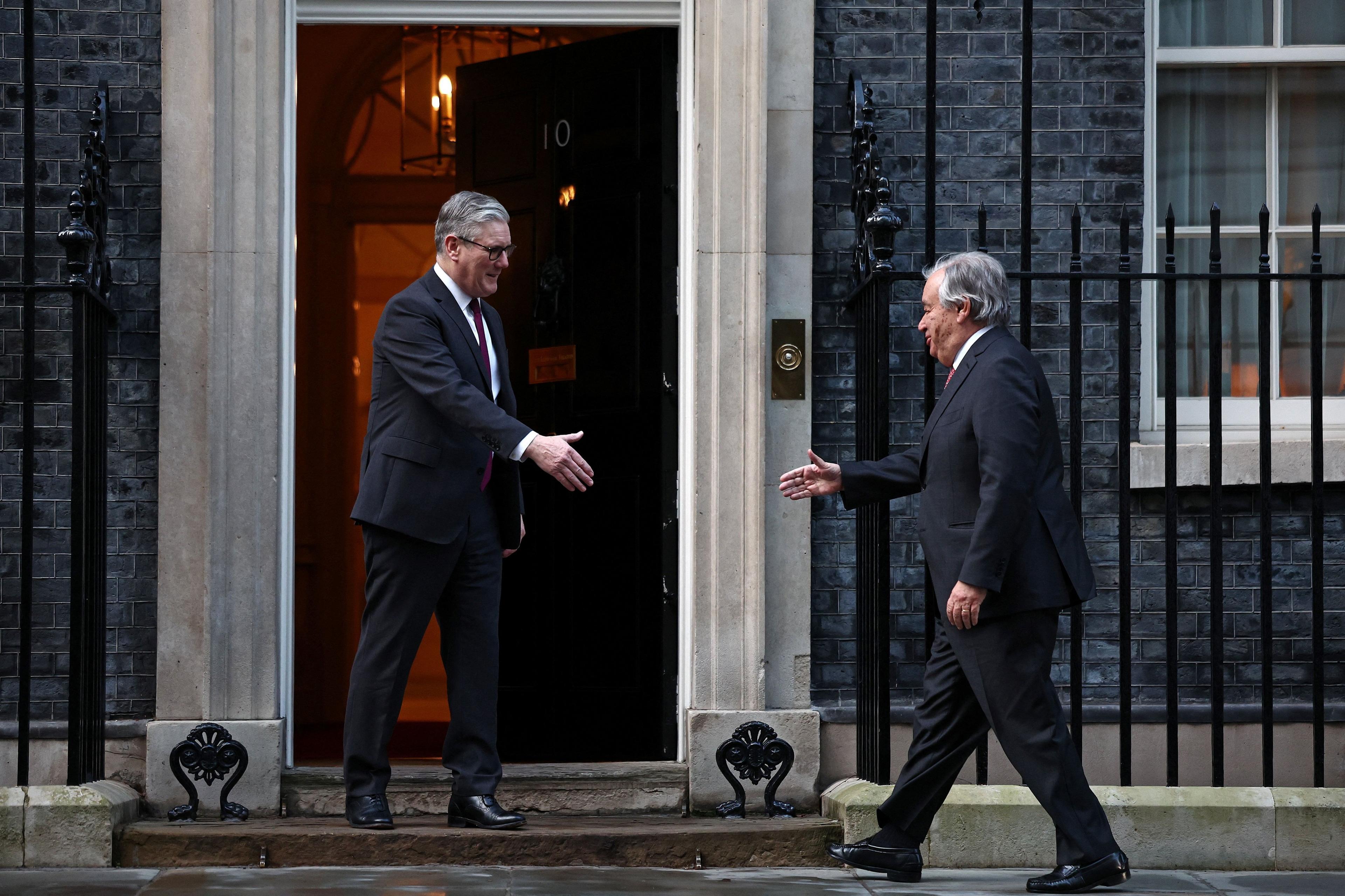 António Guterres reaching out to shake Sir Keir Starmer's hand at Downing Street in a picture taken on 16 January