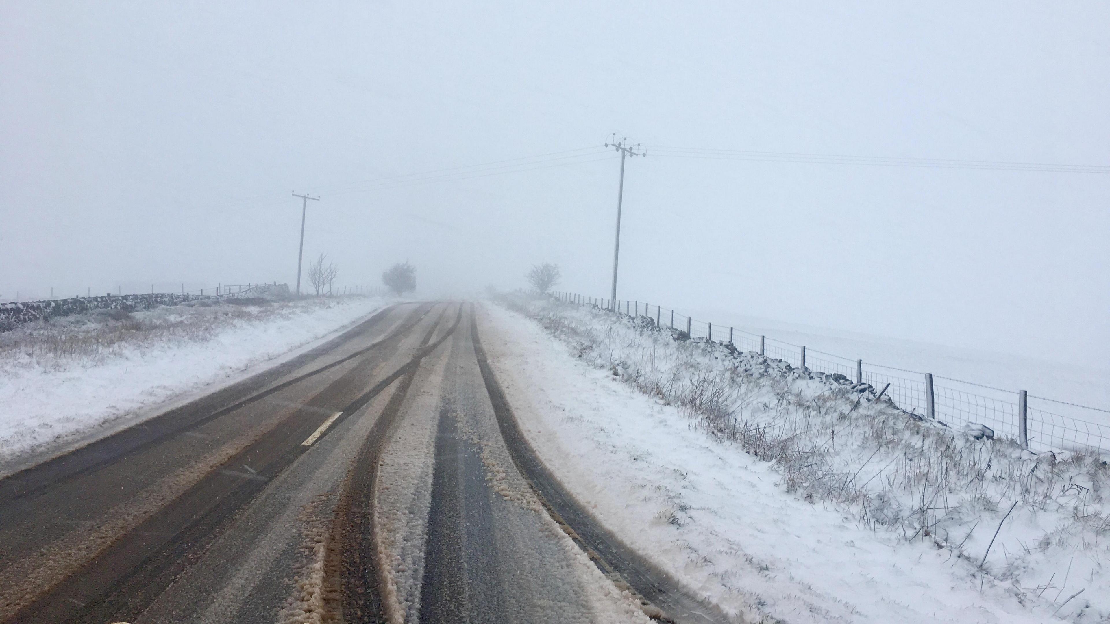 Snow on a road near Upper Hulme