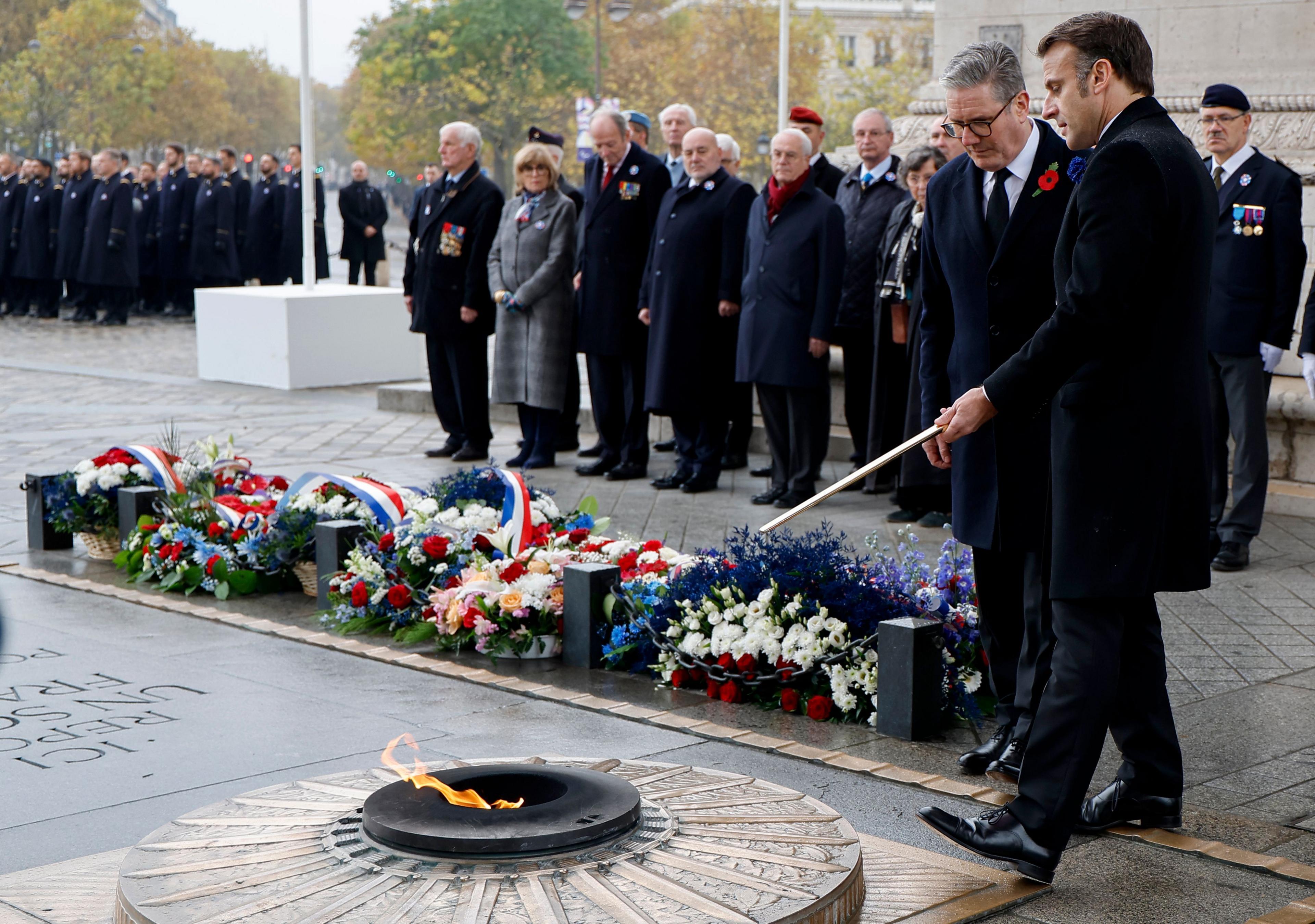 The world leaders lay a wreath at the Tomb of the Unknown Soldier in Paris as a guest of French President Emmanuel Macron.