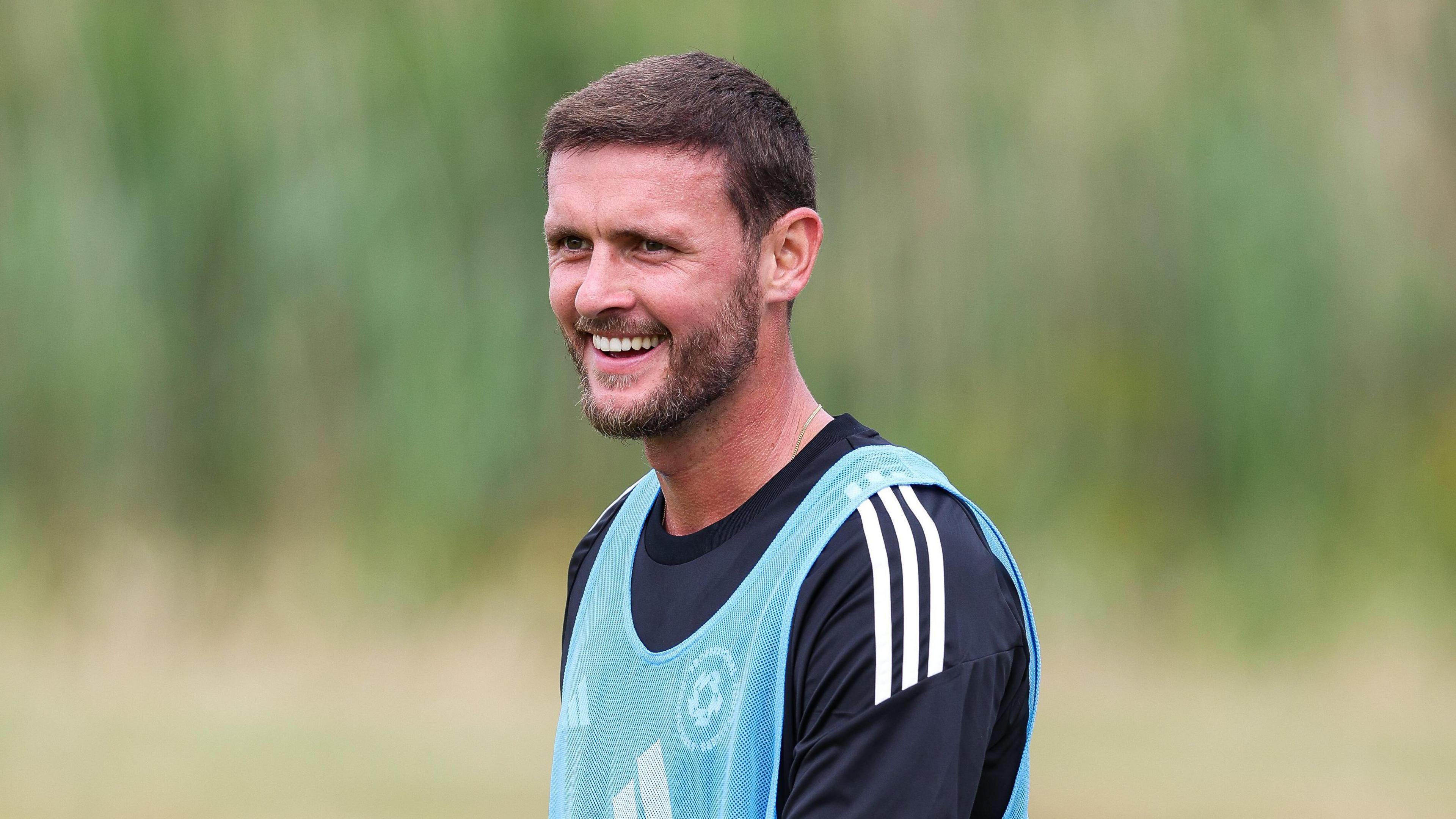 John Swift smiling in training