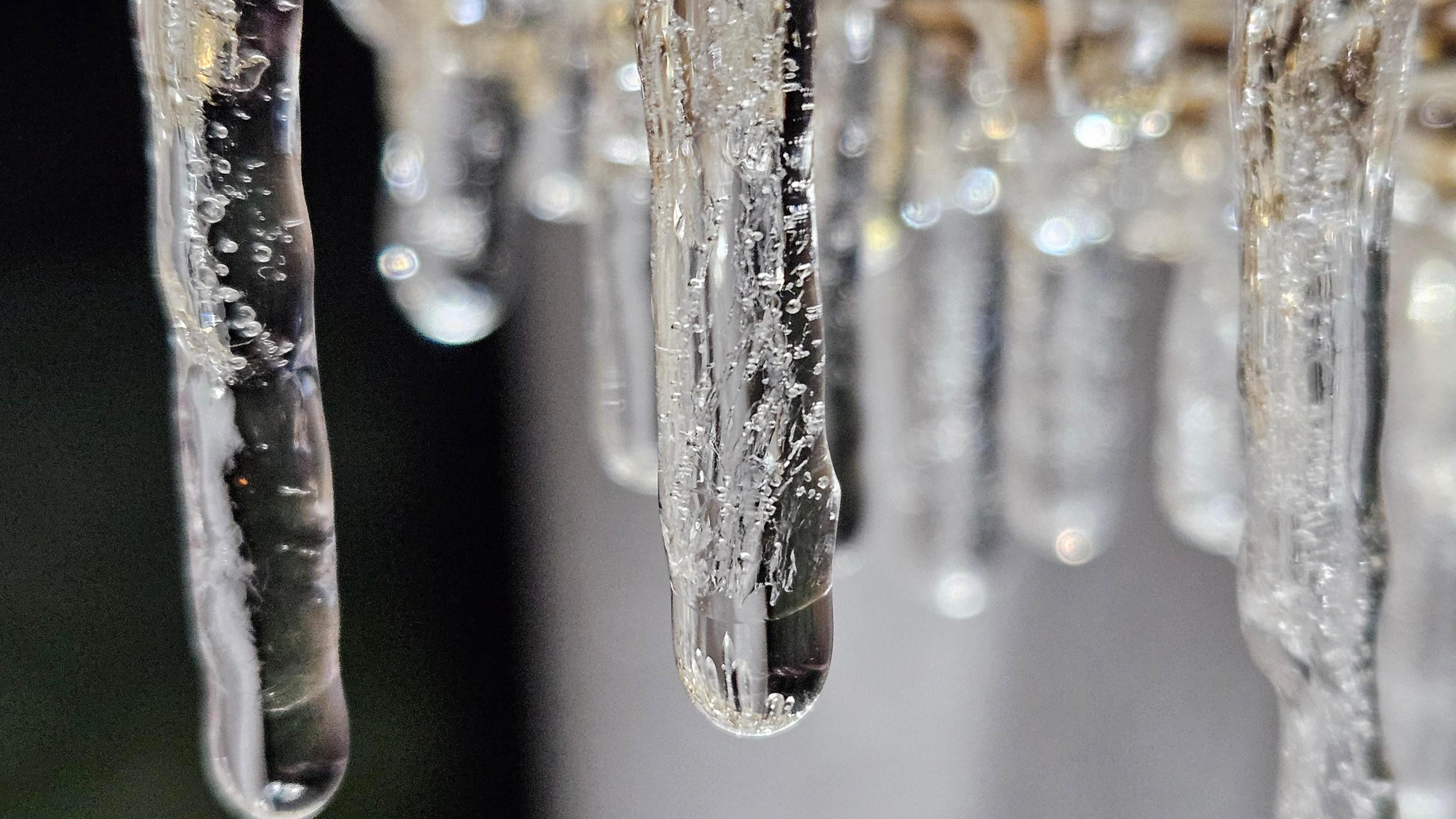 A close-up shot of icicles sparkling.