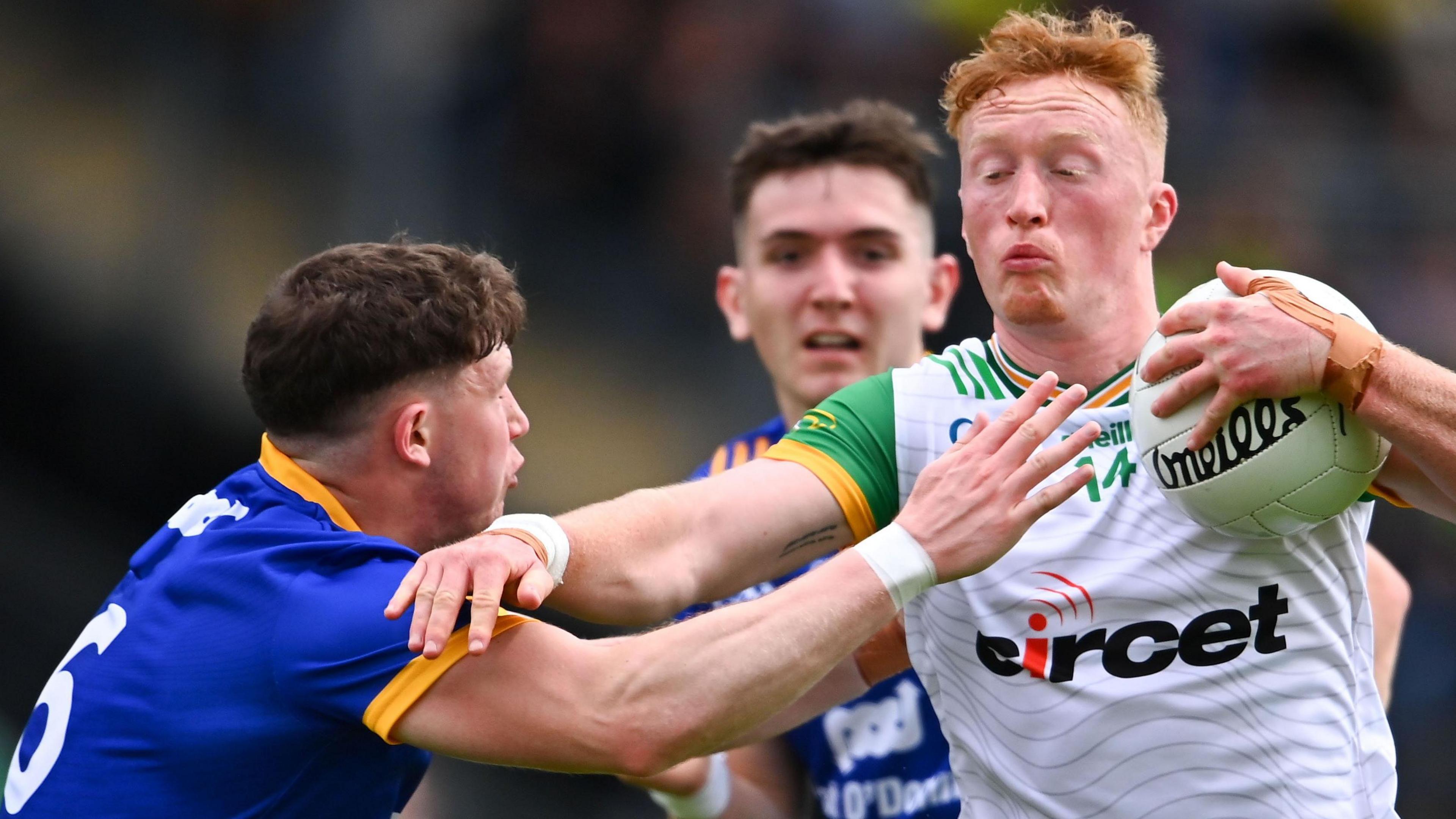 Donegal full-forward Oisin Gallen fends off Clare's Cillian Rouine at Castlebar