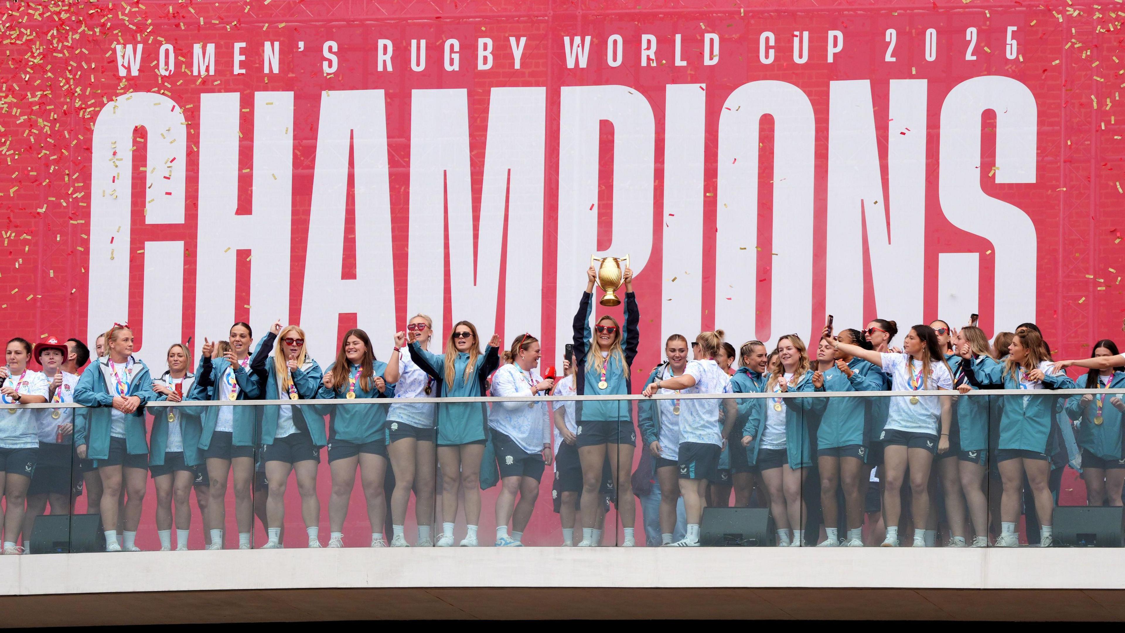 England's Zoe Aldcroft celebrates with the trophy in front of the fans during a Champions Party at Battersea Power Station, London. England won the Women's World Cup with a 33-13 victory over Canada at Allianz Stadium. Picture date: Sunday September 28, 2025. 