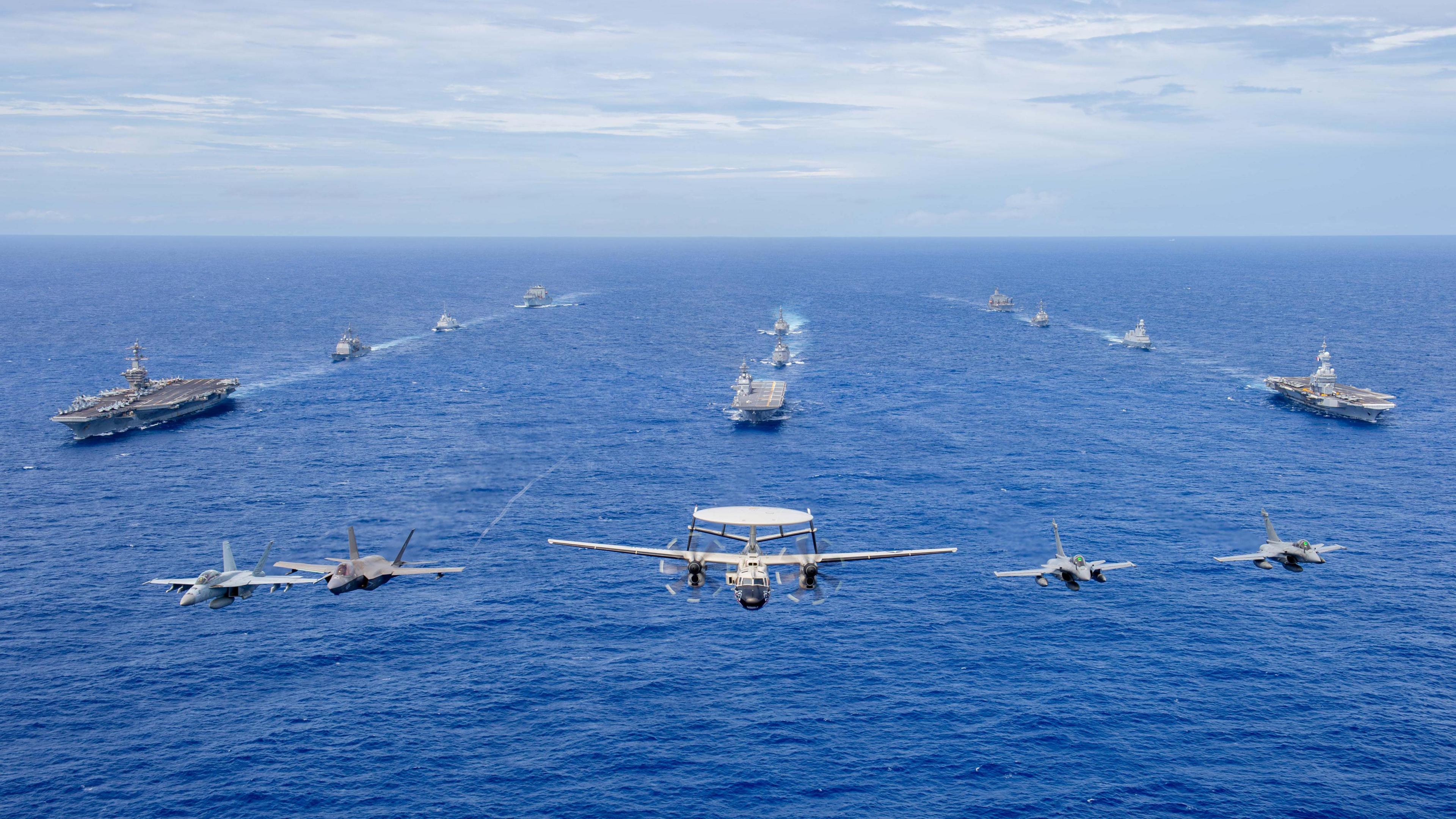 The USS Carl Vinson, left, JS Kaga, centre, and FS Charles de Gaulle, right, taking part in joint exercise Pacific Stellar