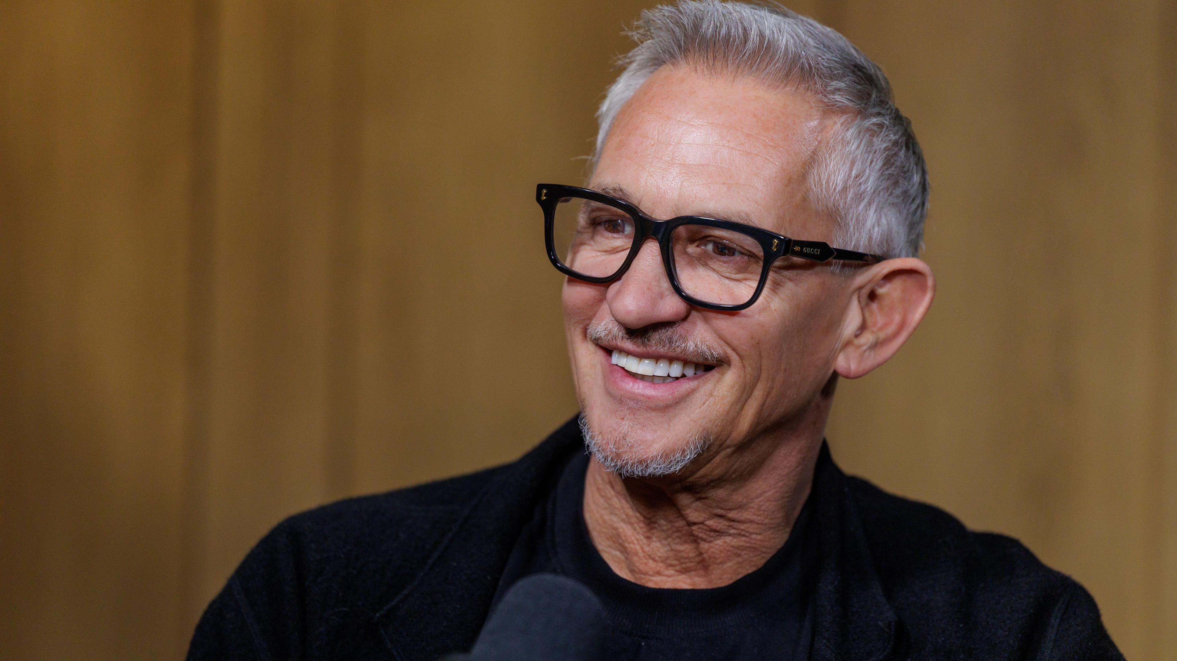 Gary Lineker smiling. He wears a black top.