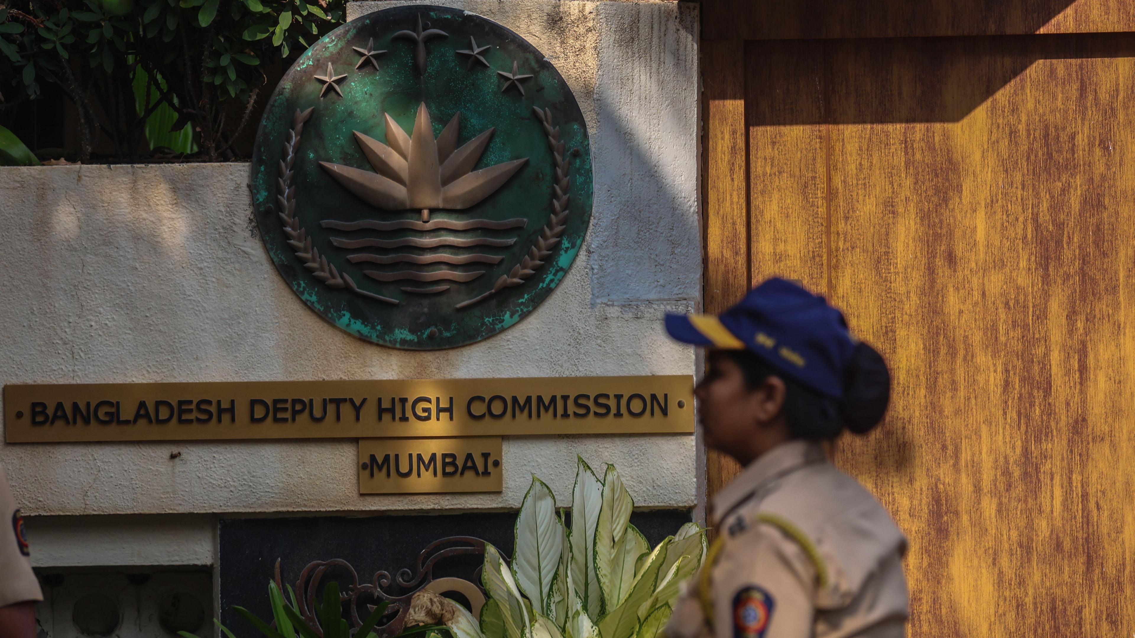 An Indian policewoman walks outside the Bangladeshi Embassy, as supporters of Hindu organizations protest against the arrest of two priests, in Mumbai, India, 02 December 2024.