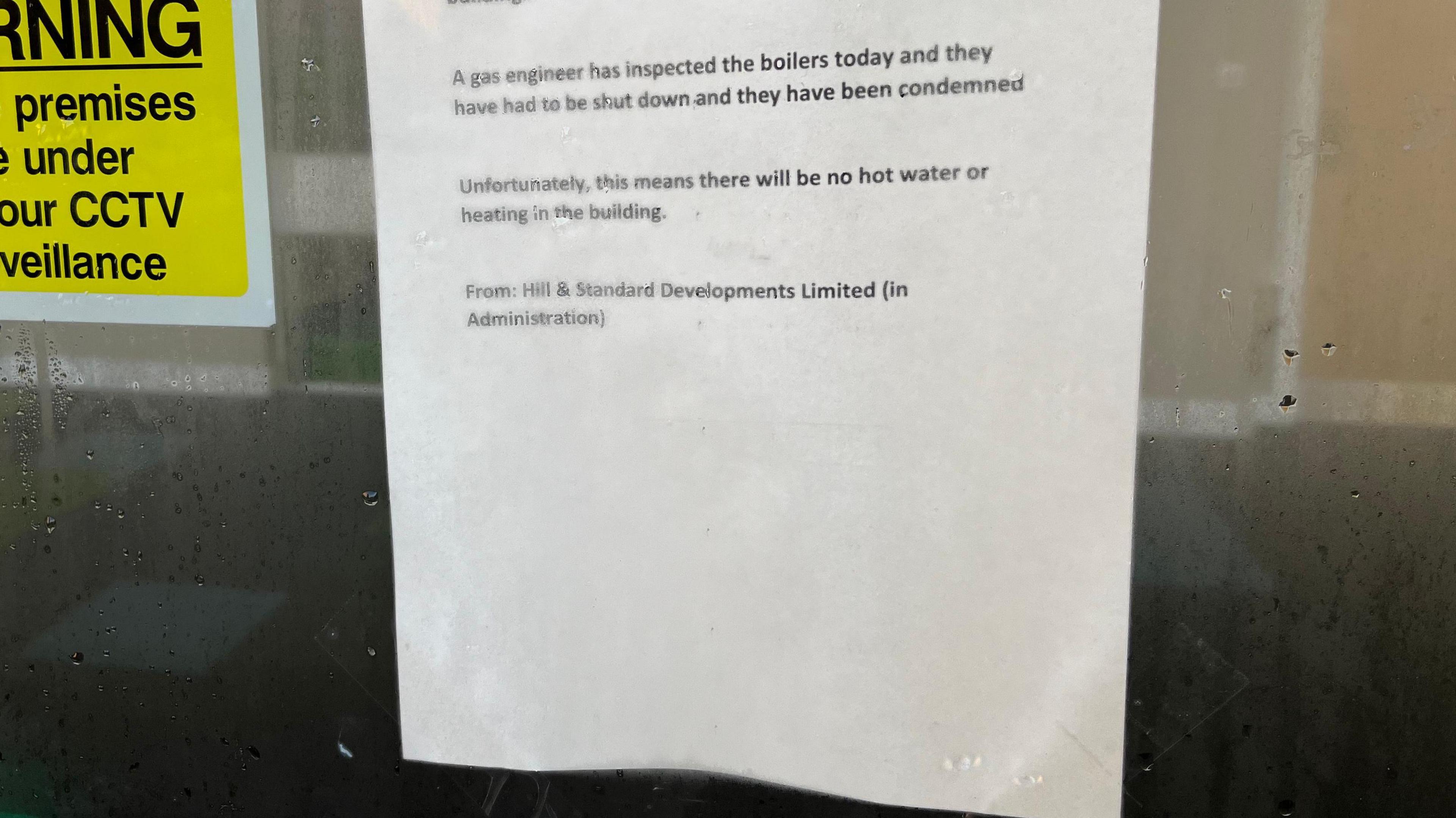 A letter saying that a building will be shut as there is no hot water or gas