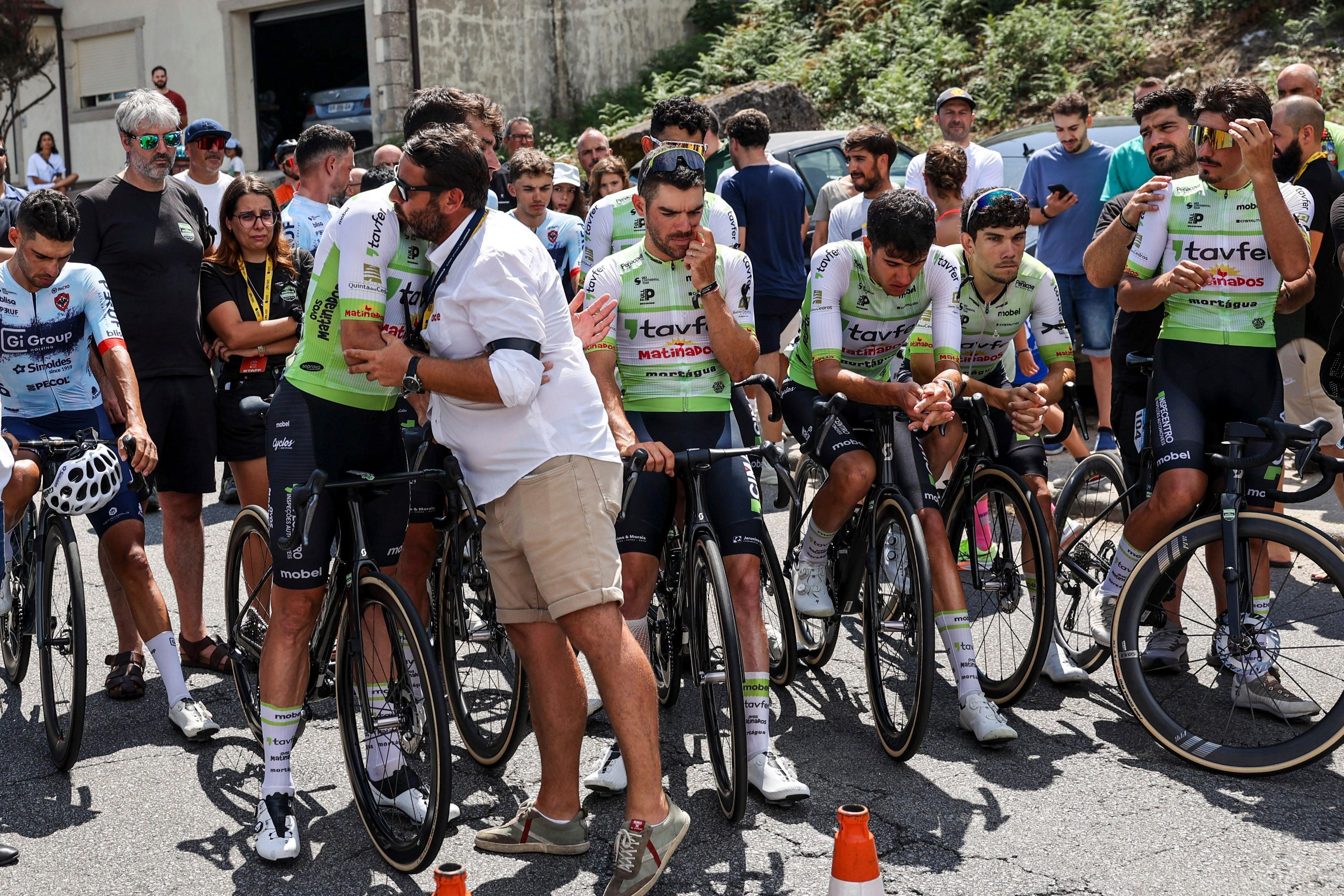 cyclists consoling one another