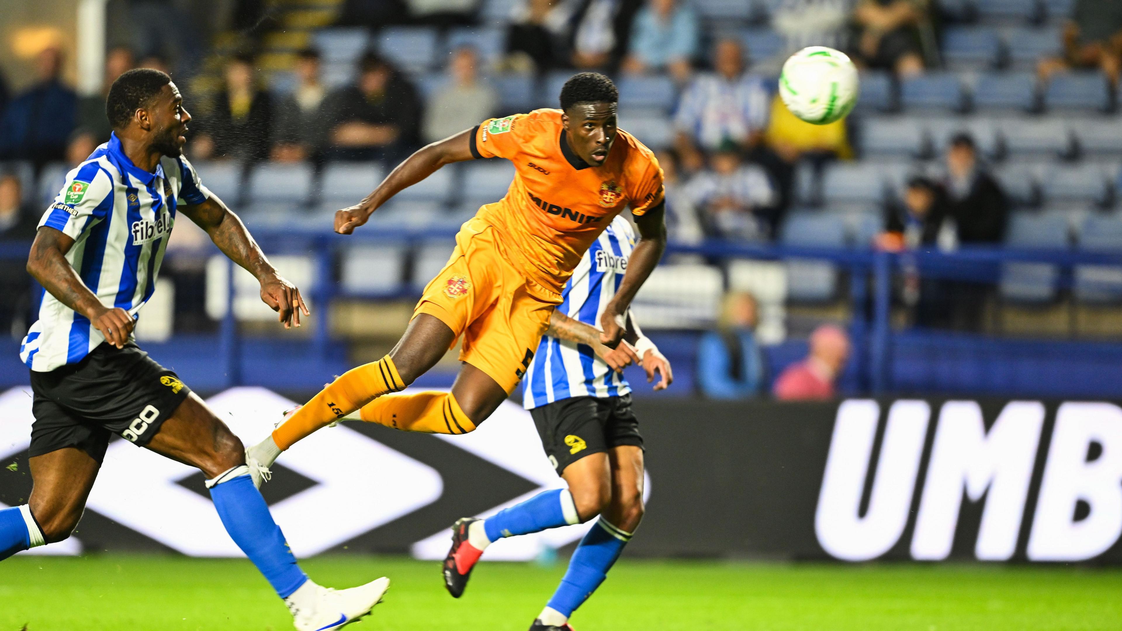 Wolves defender Saheed Olagunju heads in the ball at Hillsborough during their EFL Cup match against Sheffield Wednesday on Tuesday