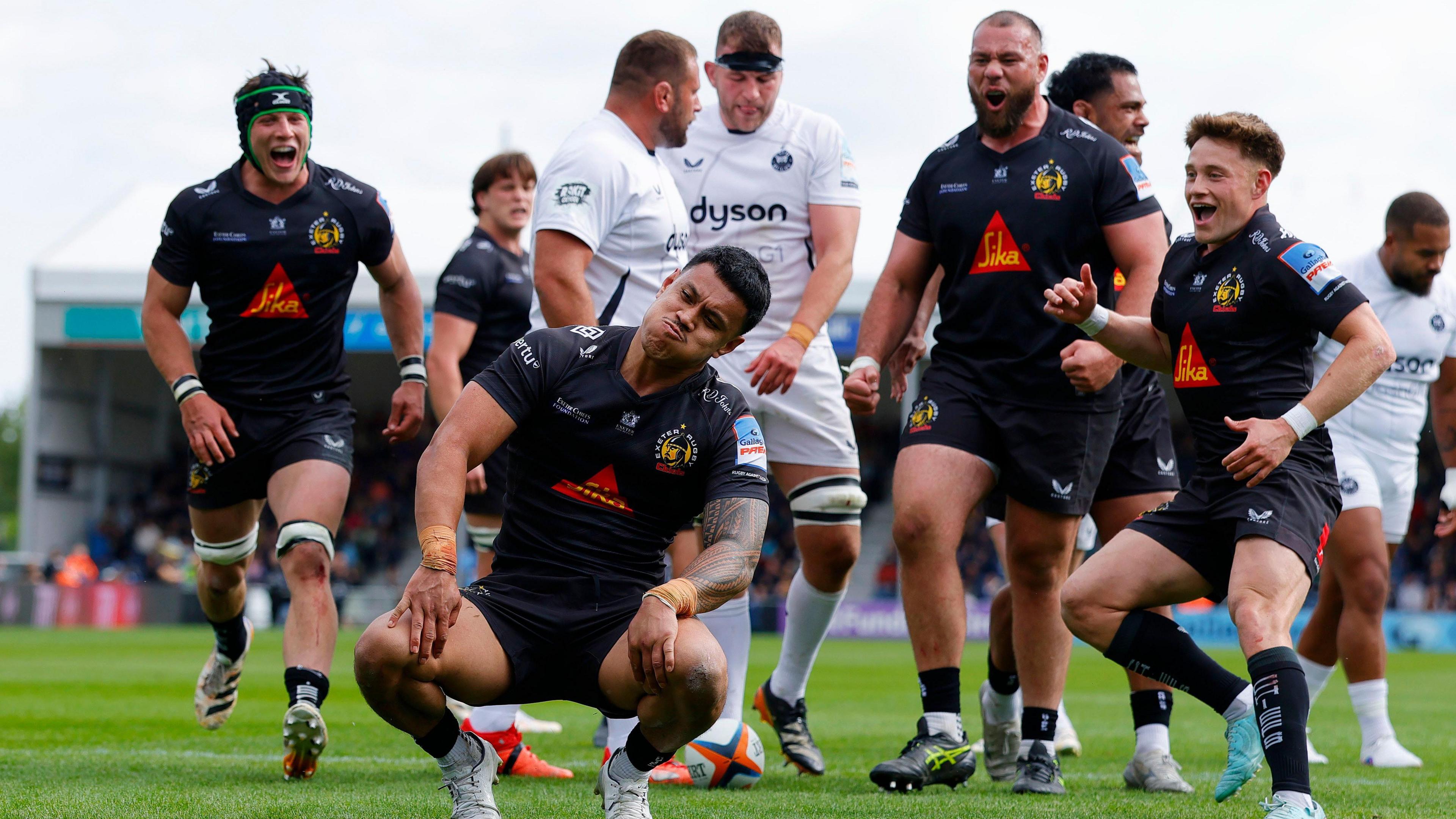 Len Ikitau celebrates scoring for Exeter