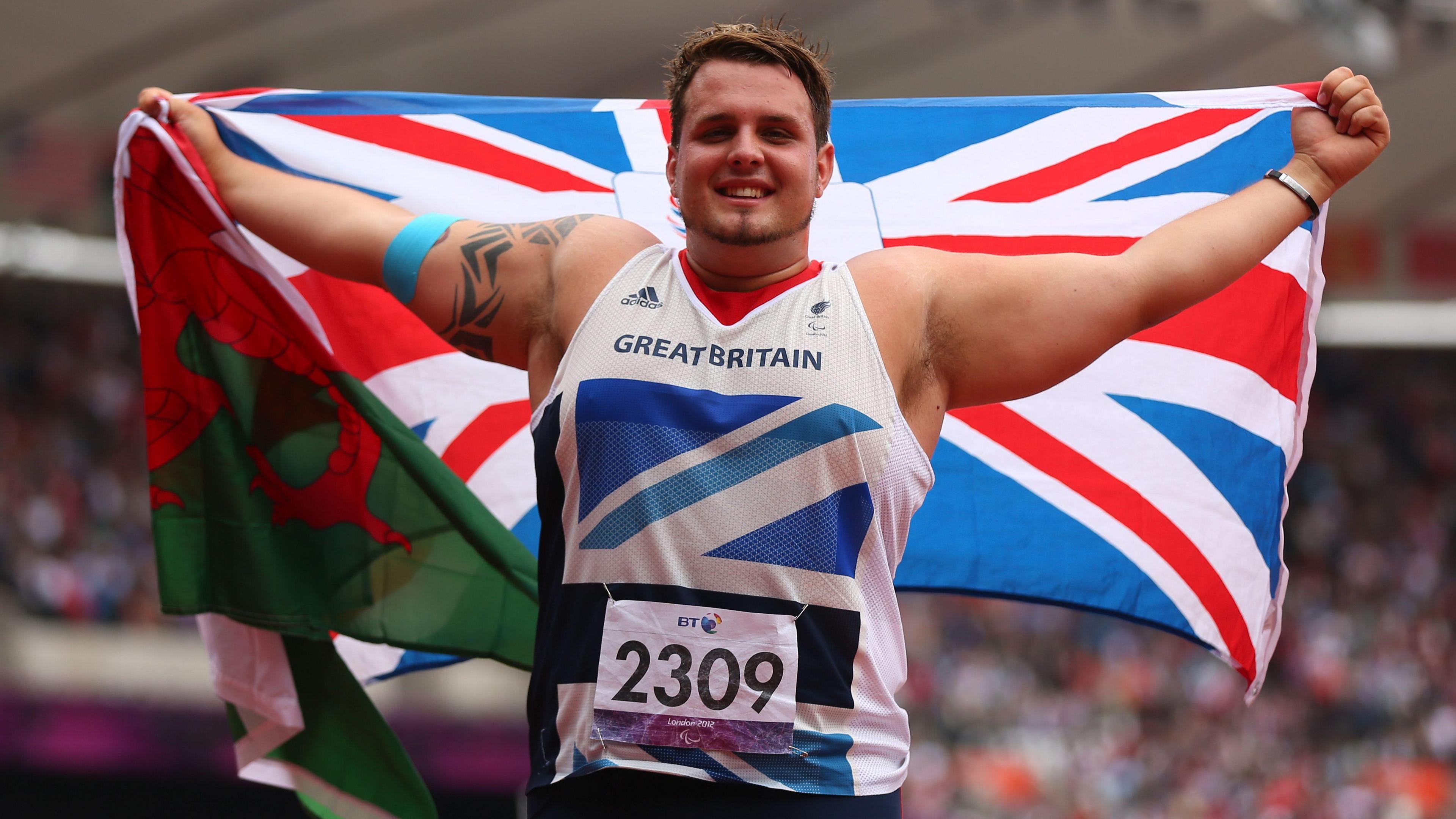 Aled Sion Davies celebrating with a Union flag at London 2012