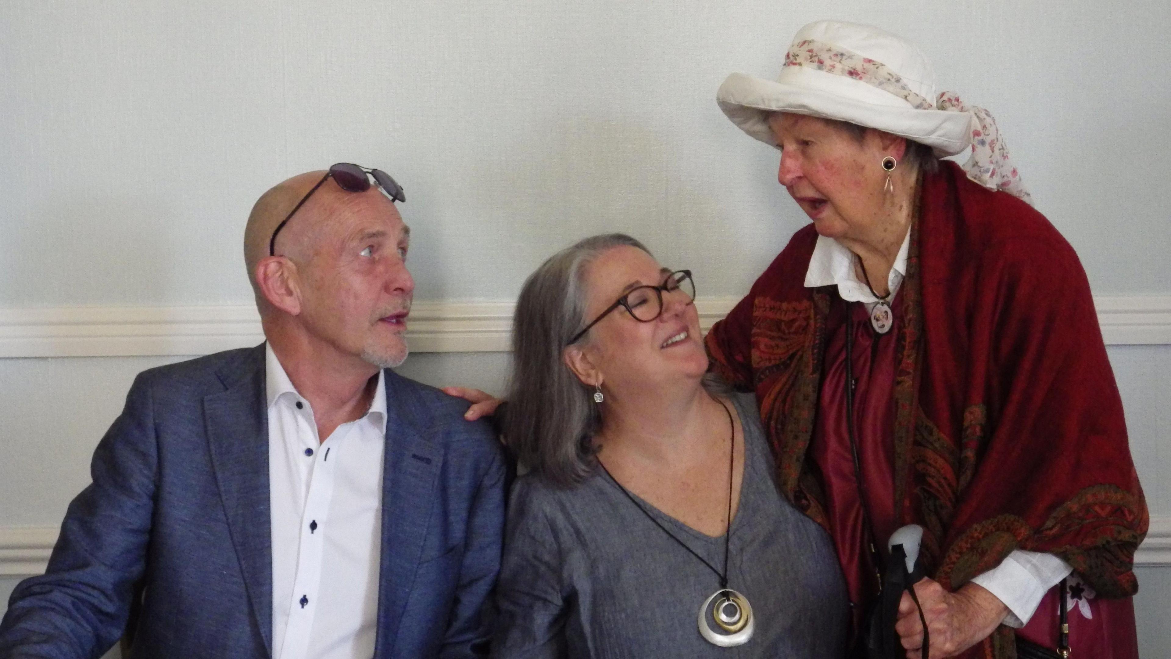 Ingrid Jones sitting between her husband, on the left, and her mother on the right, with mother and daughter smiling at each other