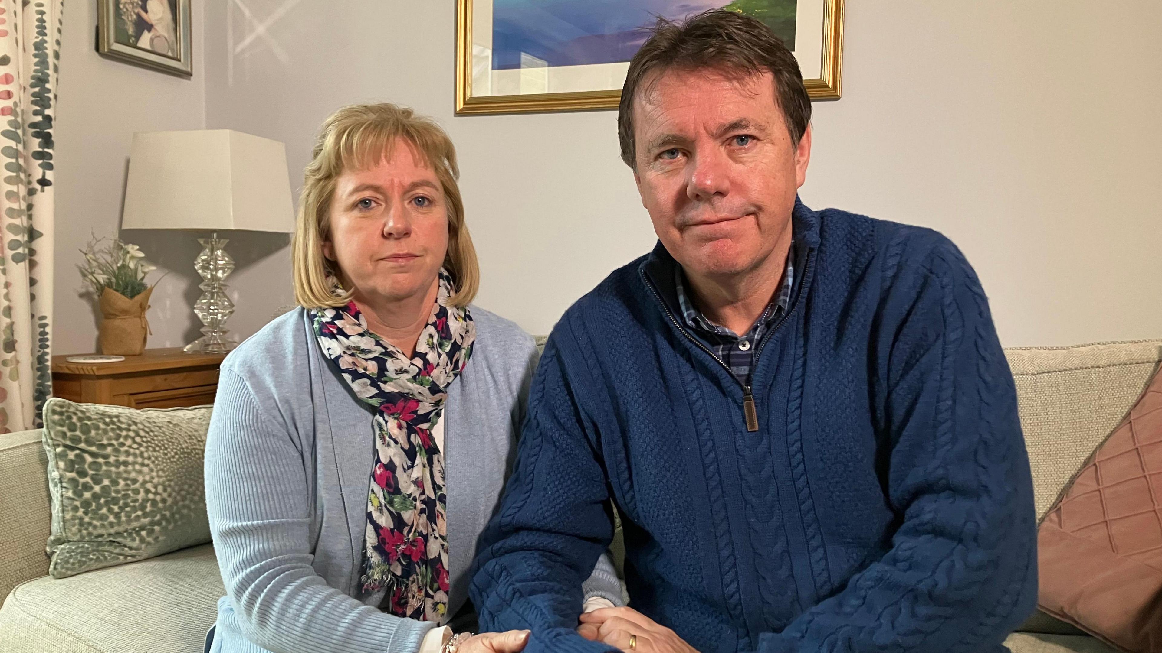 Image of Catherine and Alan O'Sullivan sitting together on a sofa