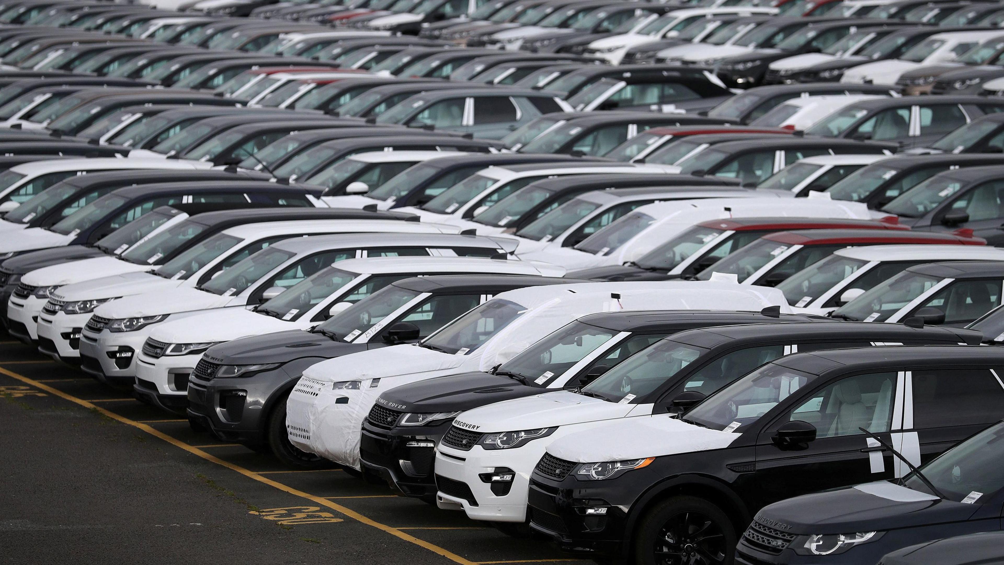 Land Rover cars are seen in a parking lot at the Jaguar Land Rover plant at Halewood