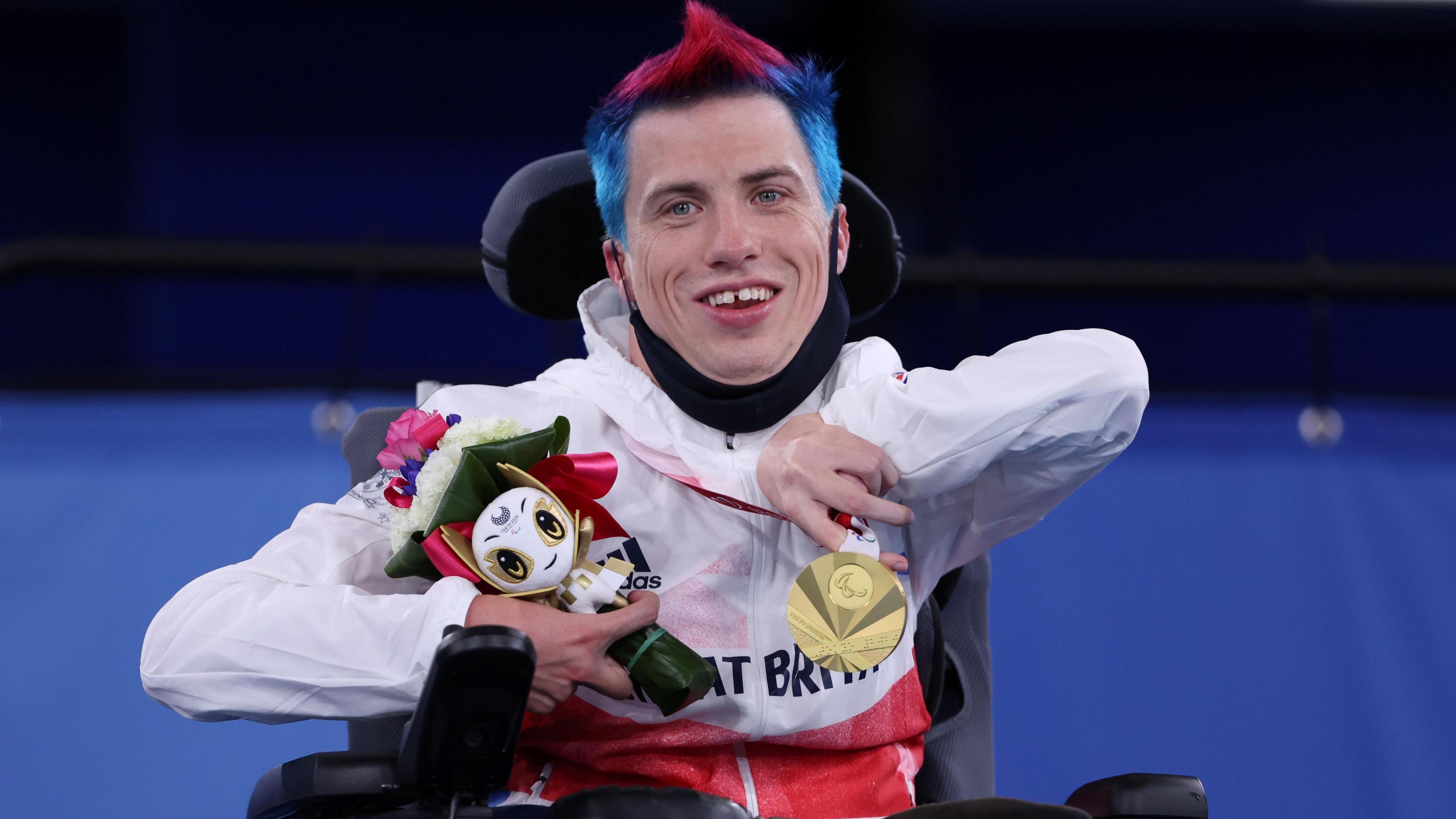 Paralympic boccia champion David Smith celebrates with his gold medal in Tokyo 2020