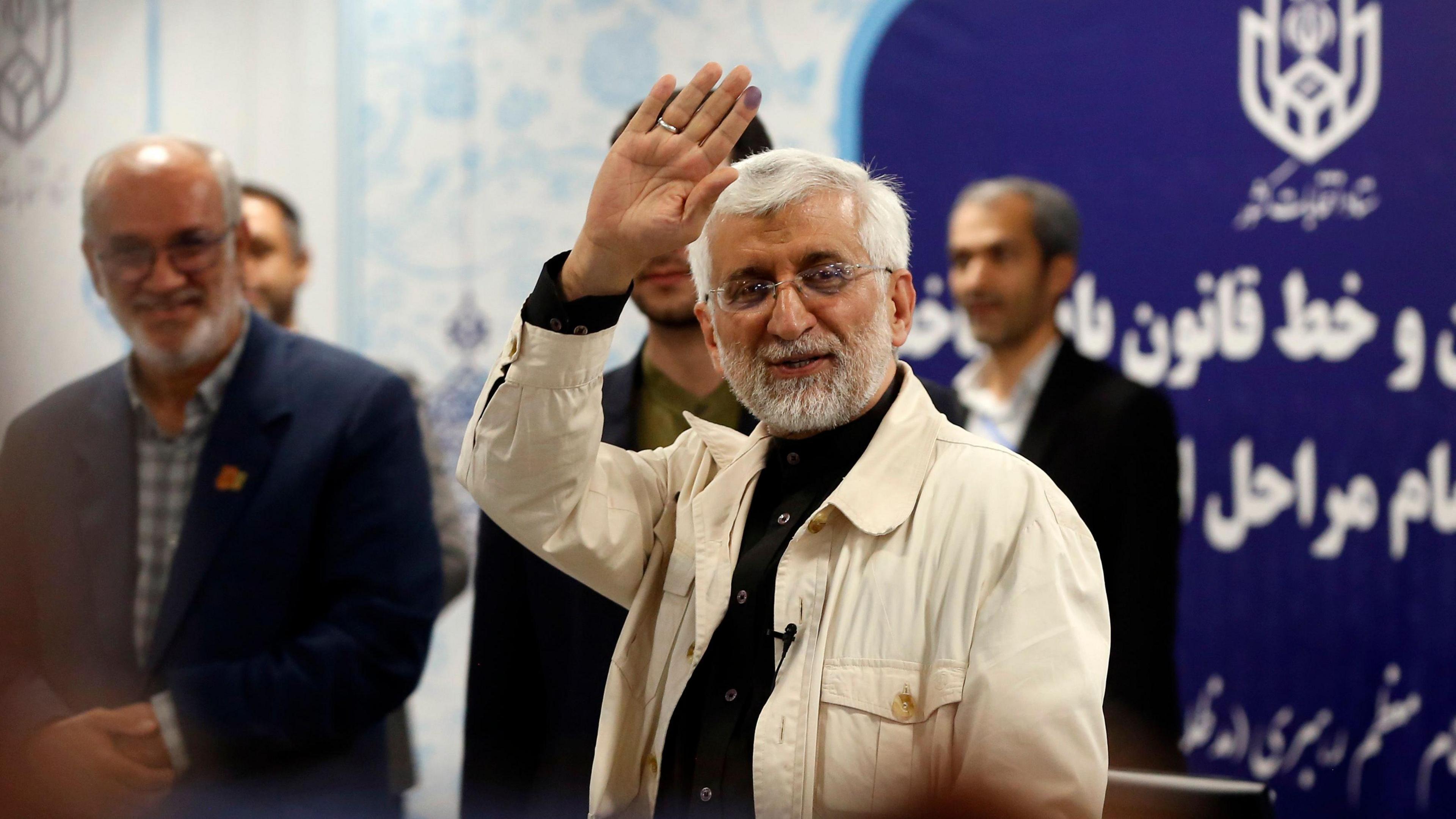 Saeed Jalili, Iran's former chief nuclear negotiator, waves after registering as a candidate for Iran's presidential election, in Tehran (30 May 2024)