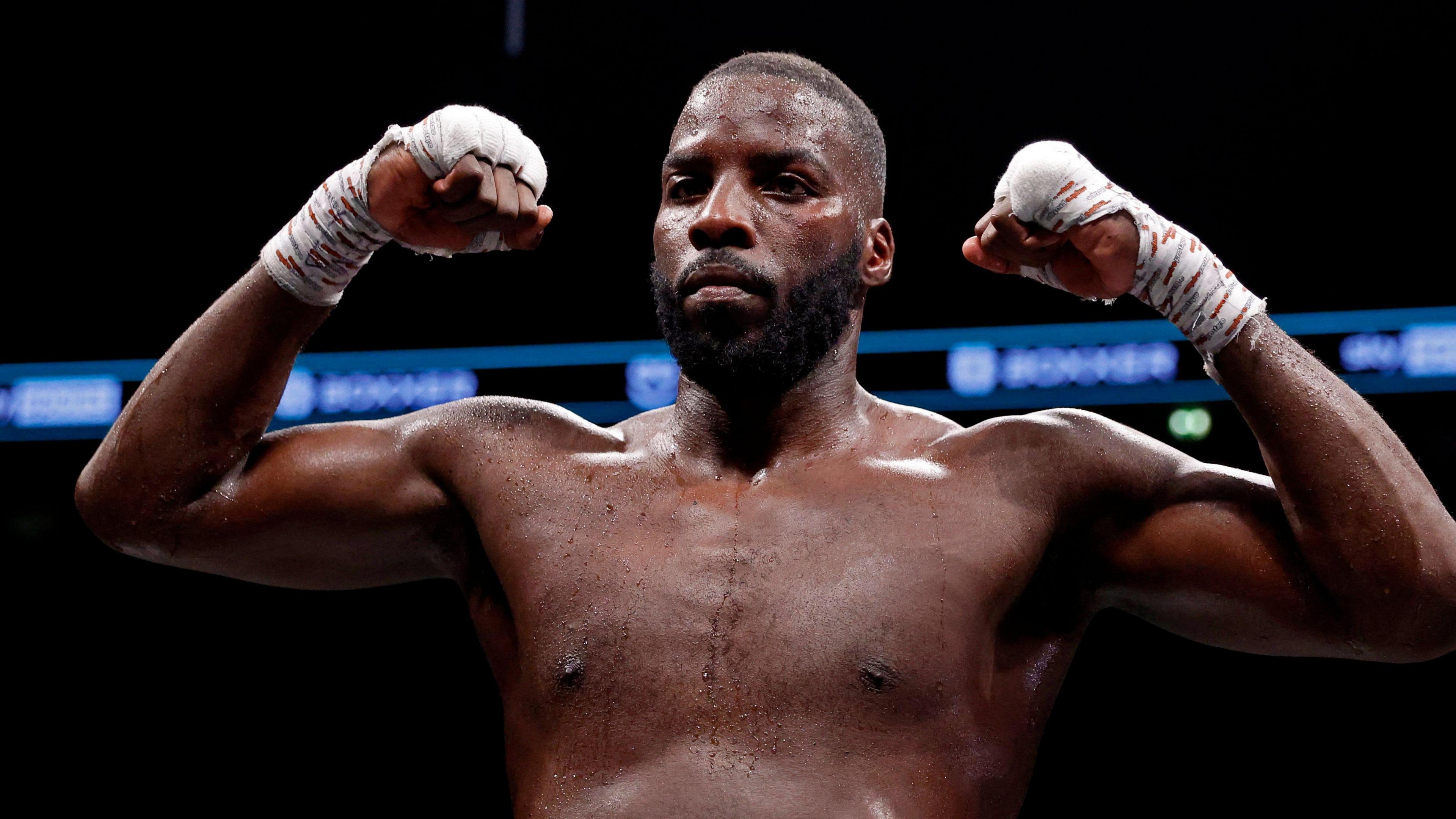 Lawrence Okolie celebrates