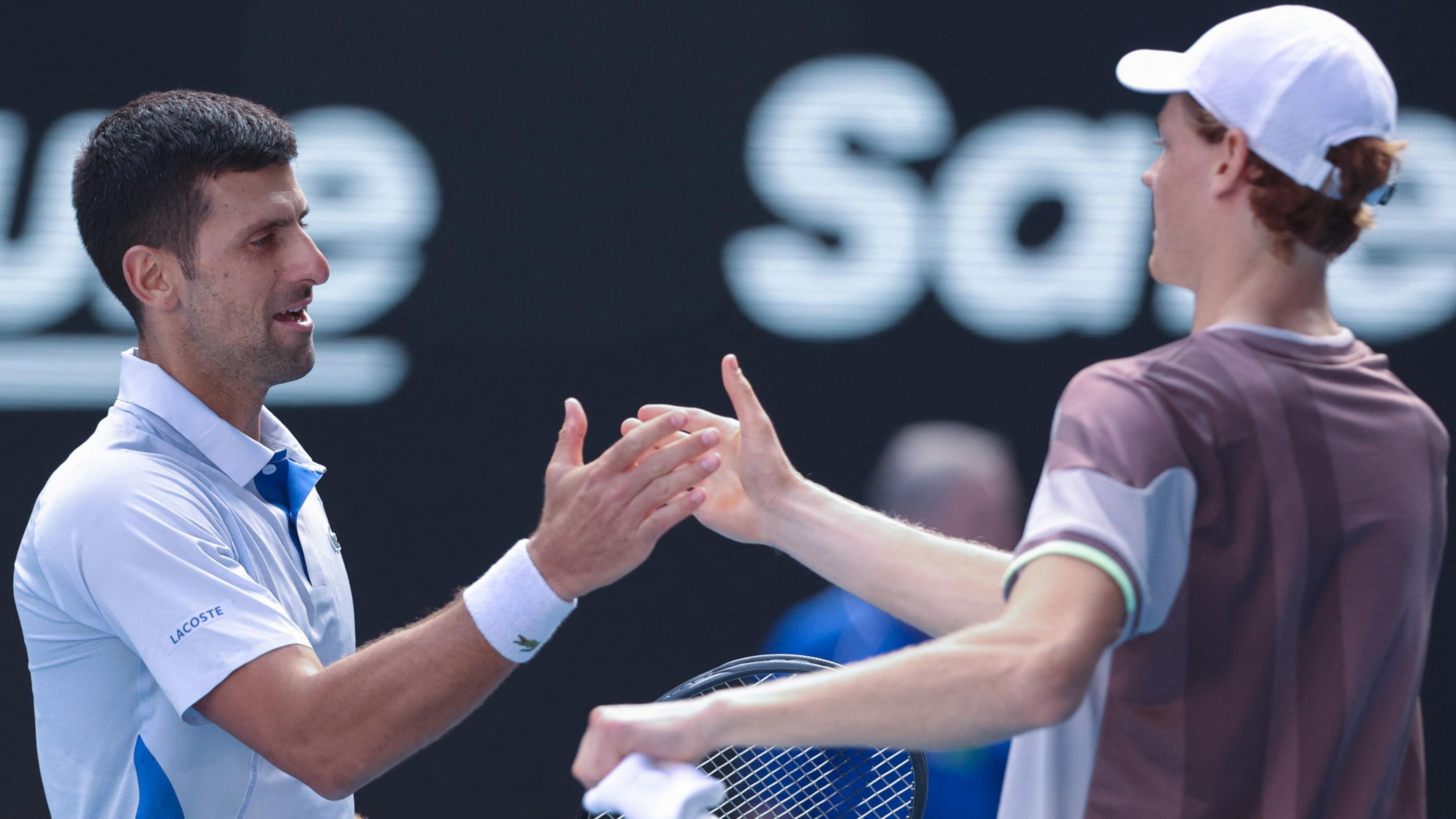 Novak Djokovic congratulates Jannik Sinner at the 2024 Australian Open - Sinner beat defending champion Djokovic in the semi-finals