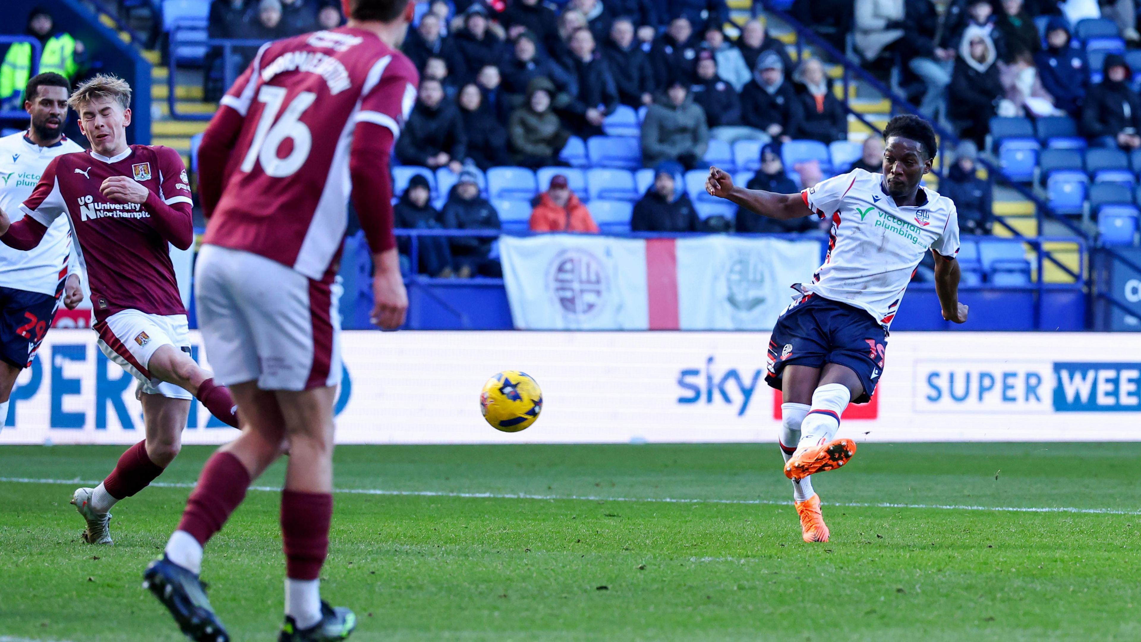 Bolton Wanderers' Amario Cozier-Duberry shot is deflected Northampton Town's Jack Perkins for a corner