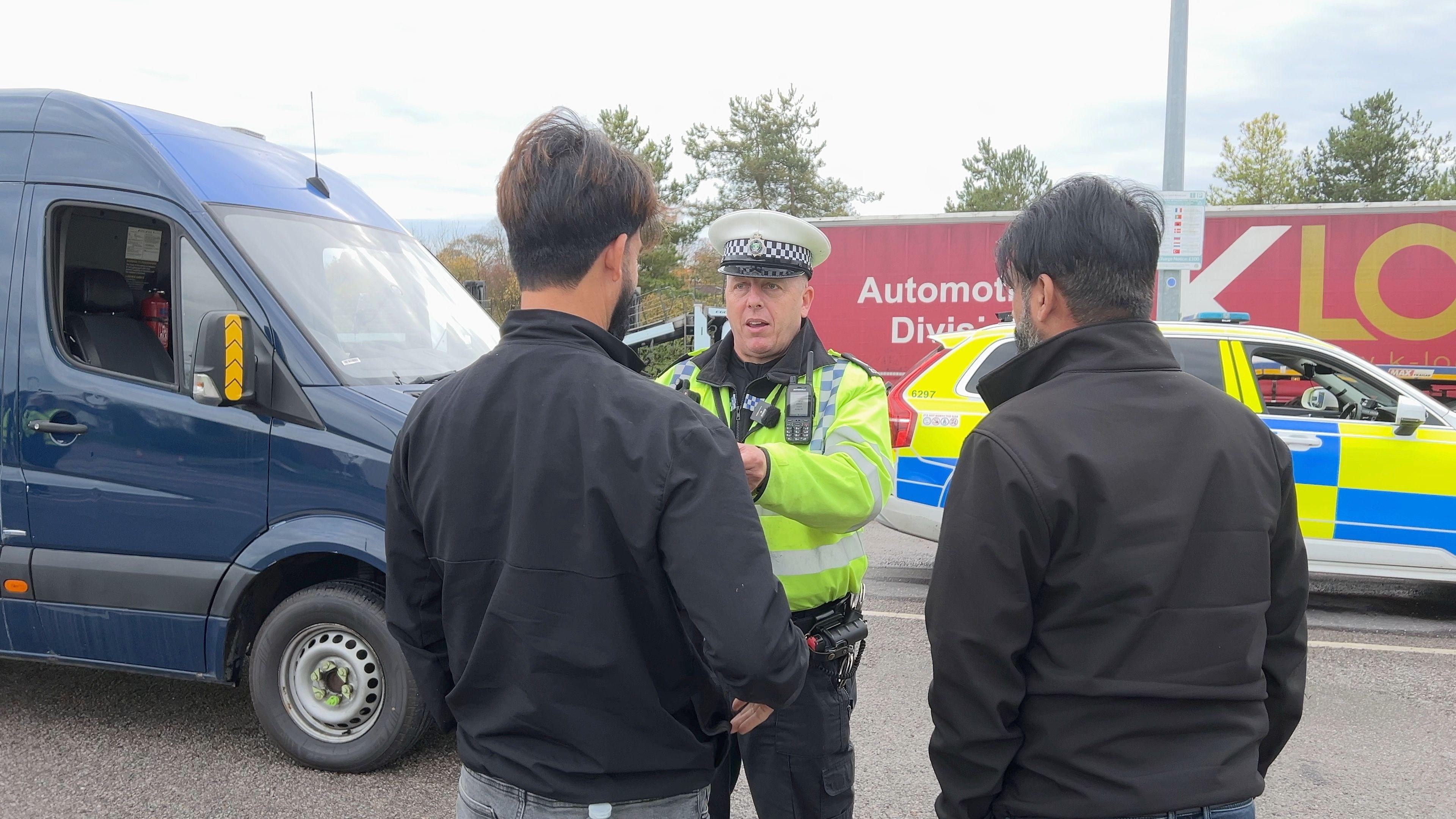 Police Sereant Paul Diamond talks to the driver of a van stopped as part of the checks.