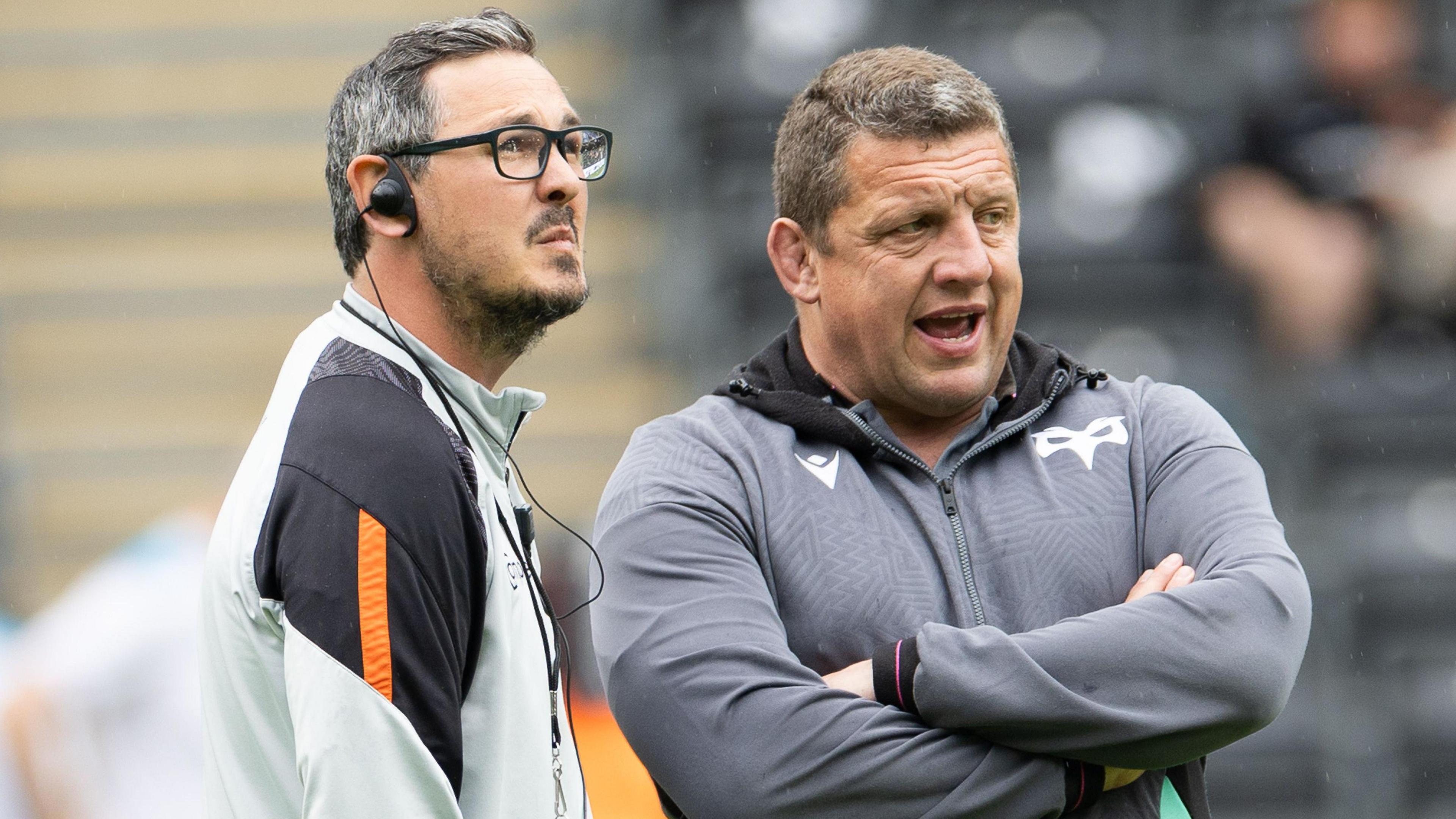 Former Dragons head coach Dai Flanagan (left) and ex-Ospreys boss Toby Boothalongside each other on the touchline