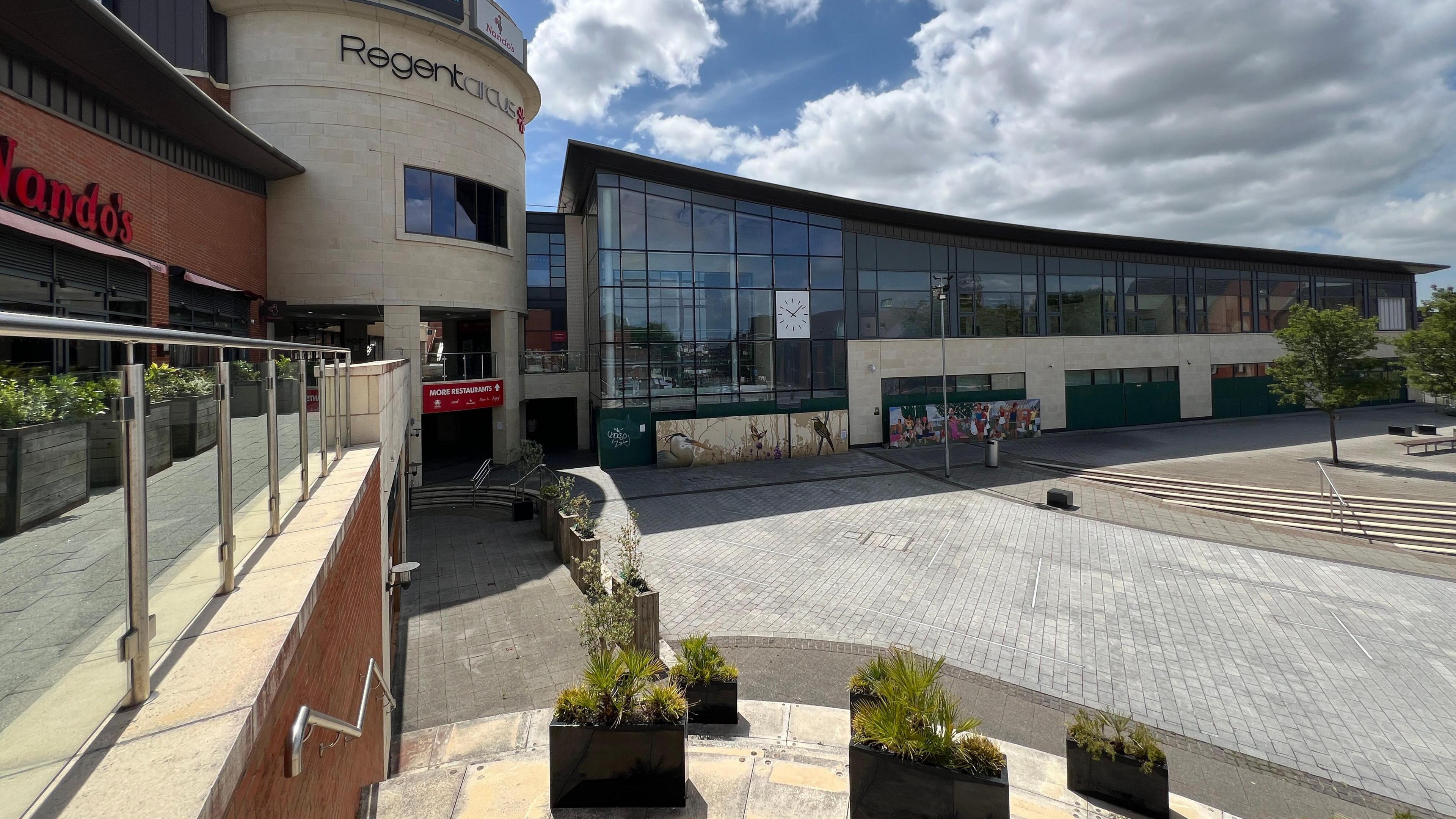 Regent Circus retail and leisure complex in Swindon town centre, with the boarded-up Morrisons store to the right of the image.