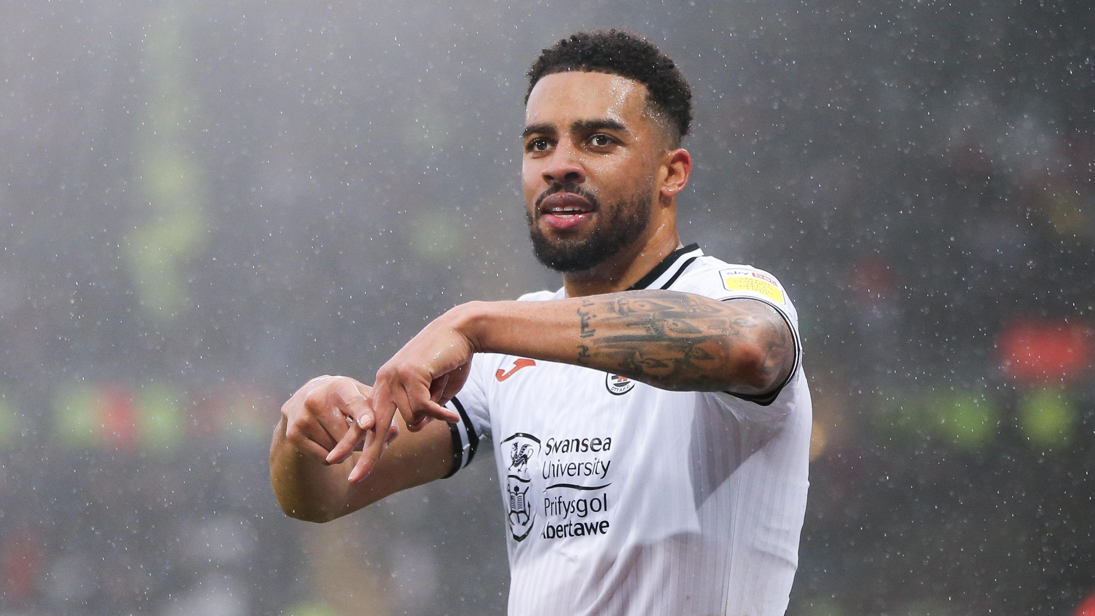 Cyrus Christie celebrates during his loan spell at Swansea