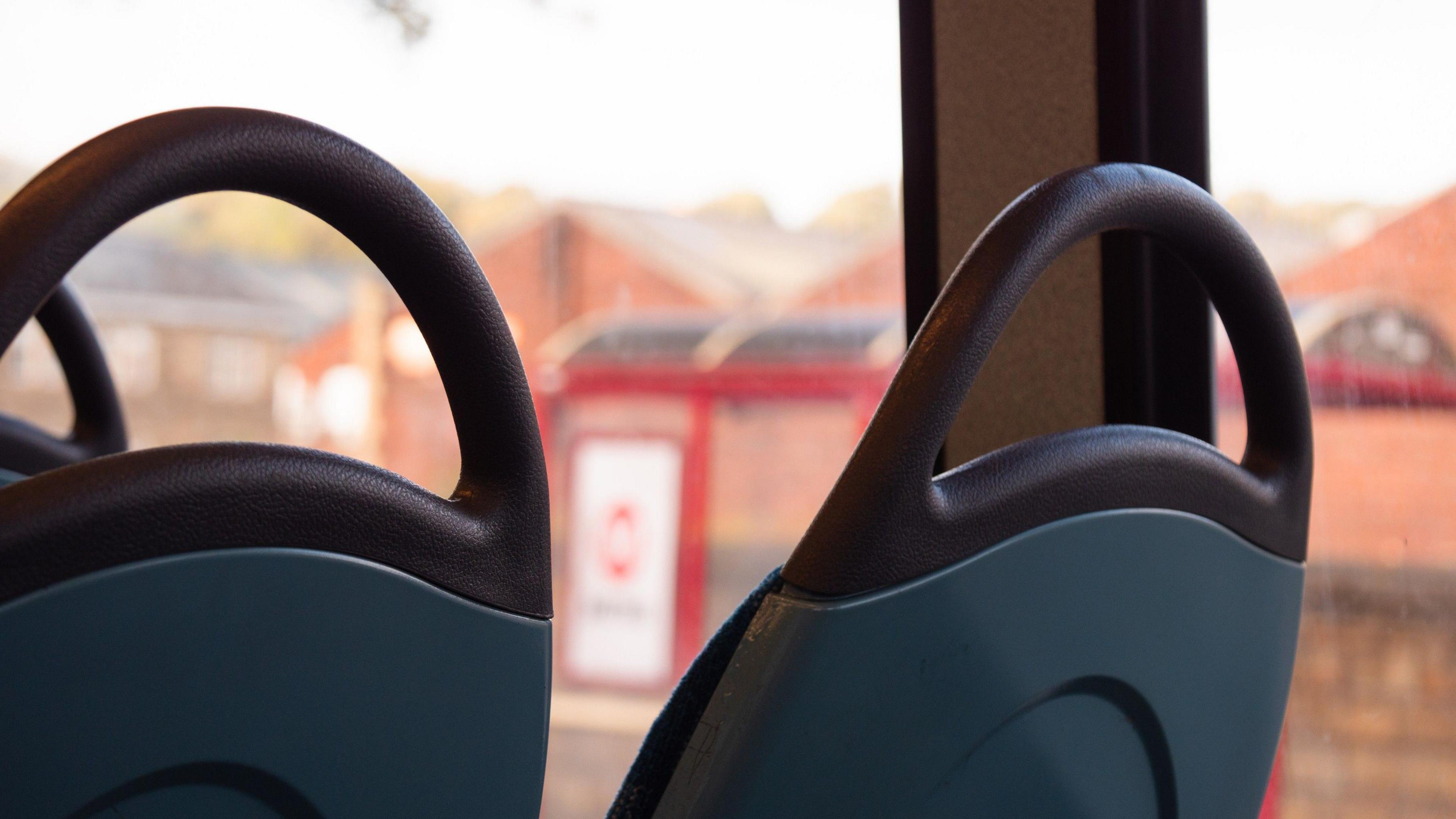 Two empty seats on a bus.