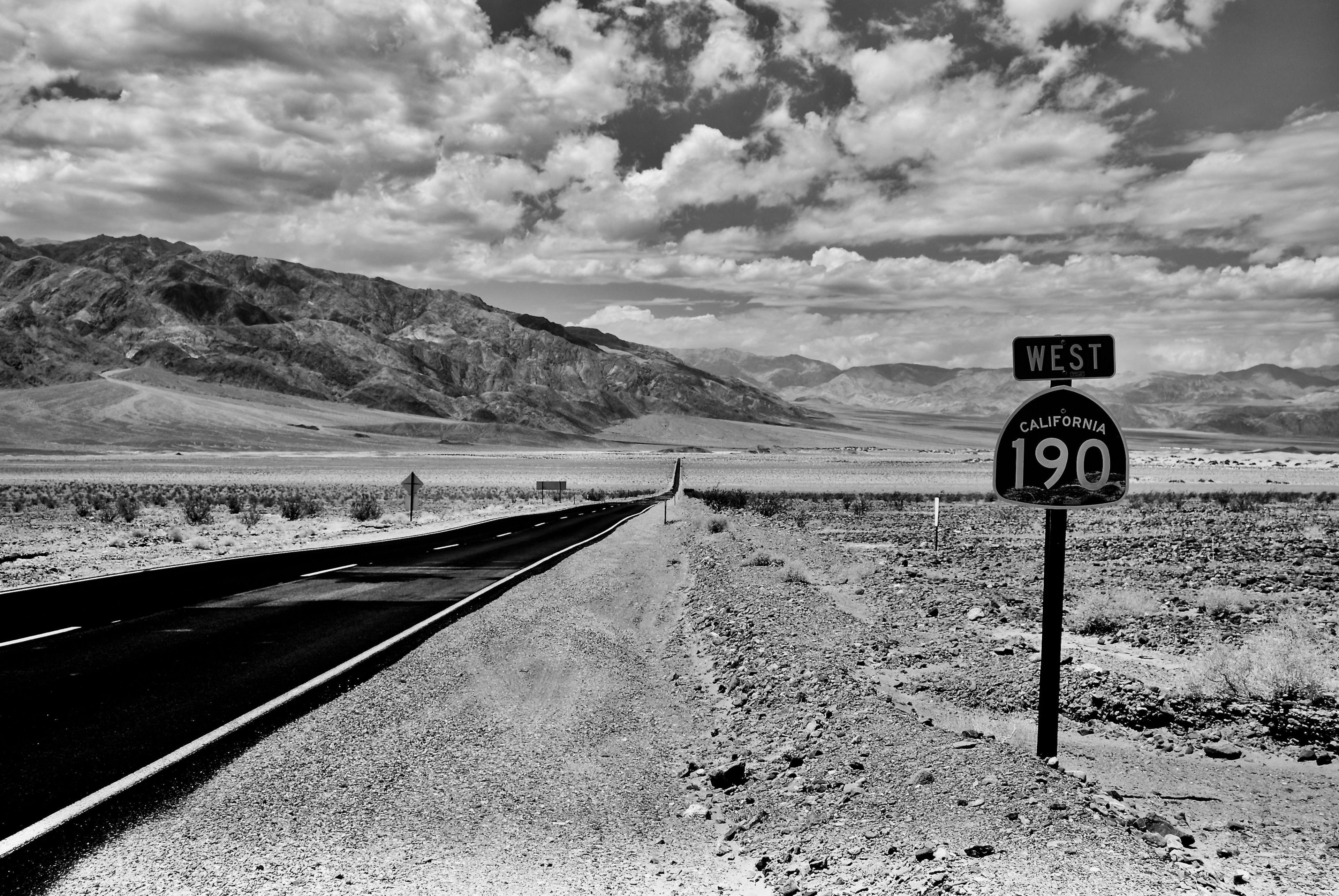 A road passes through a barren valley