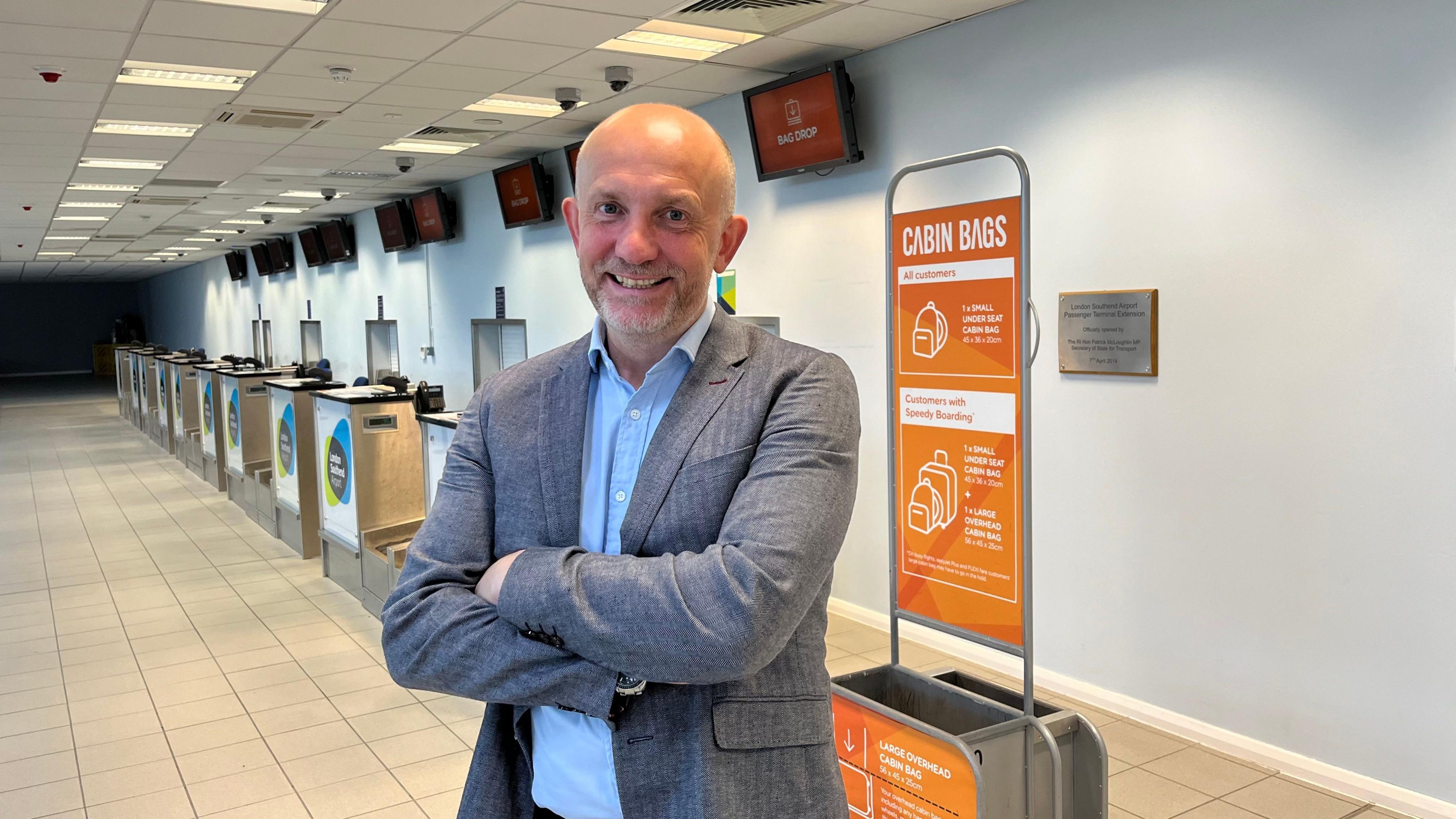 John Upton standing inside Southend airport