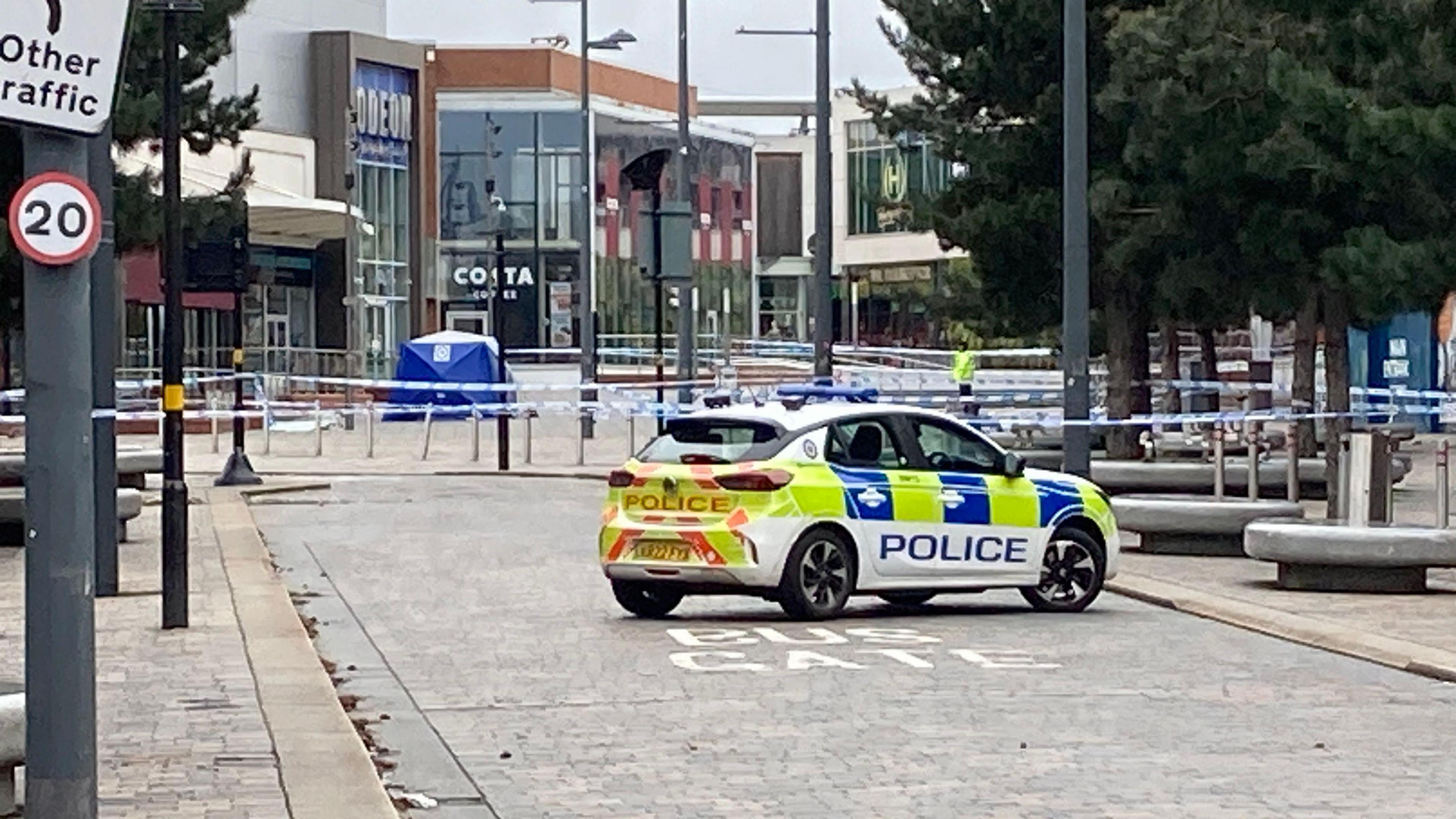 The shopping precinct remains cordoned off 