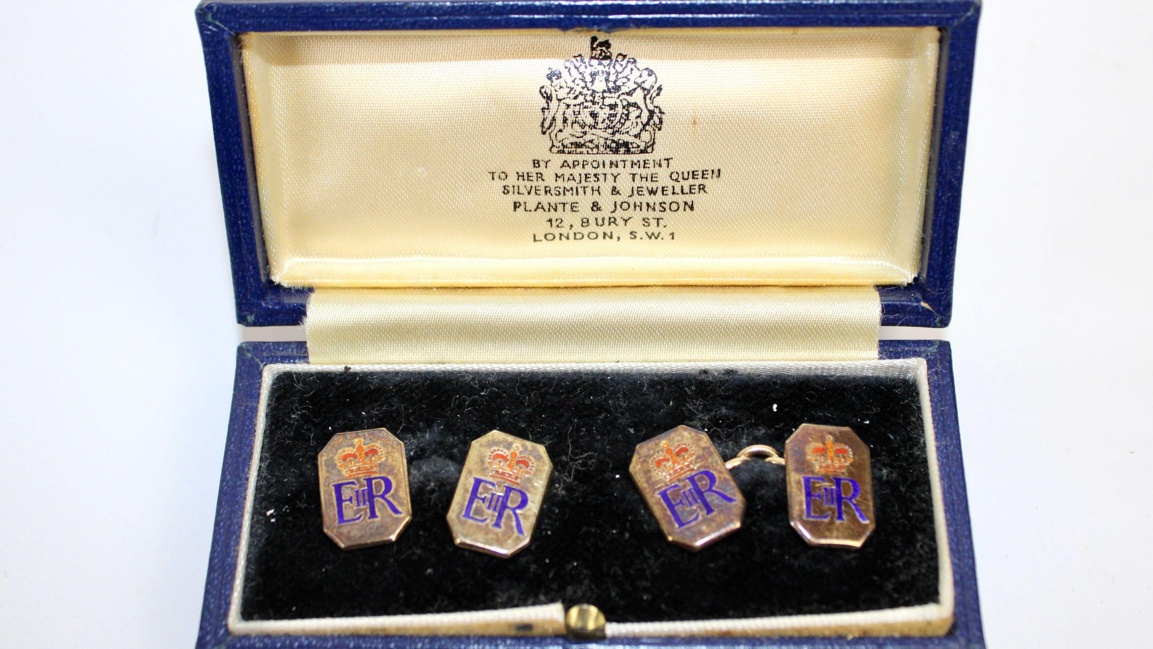 A pair of 9ct gold and enamel octagonal cufflinks with crowned ERII ciphers presented by Queen Elizabeth II to Squadron Leader Denis Lowery.