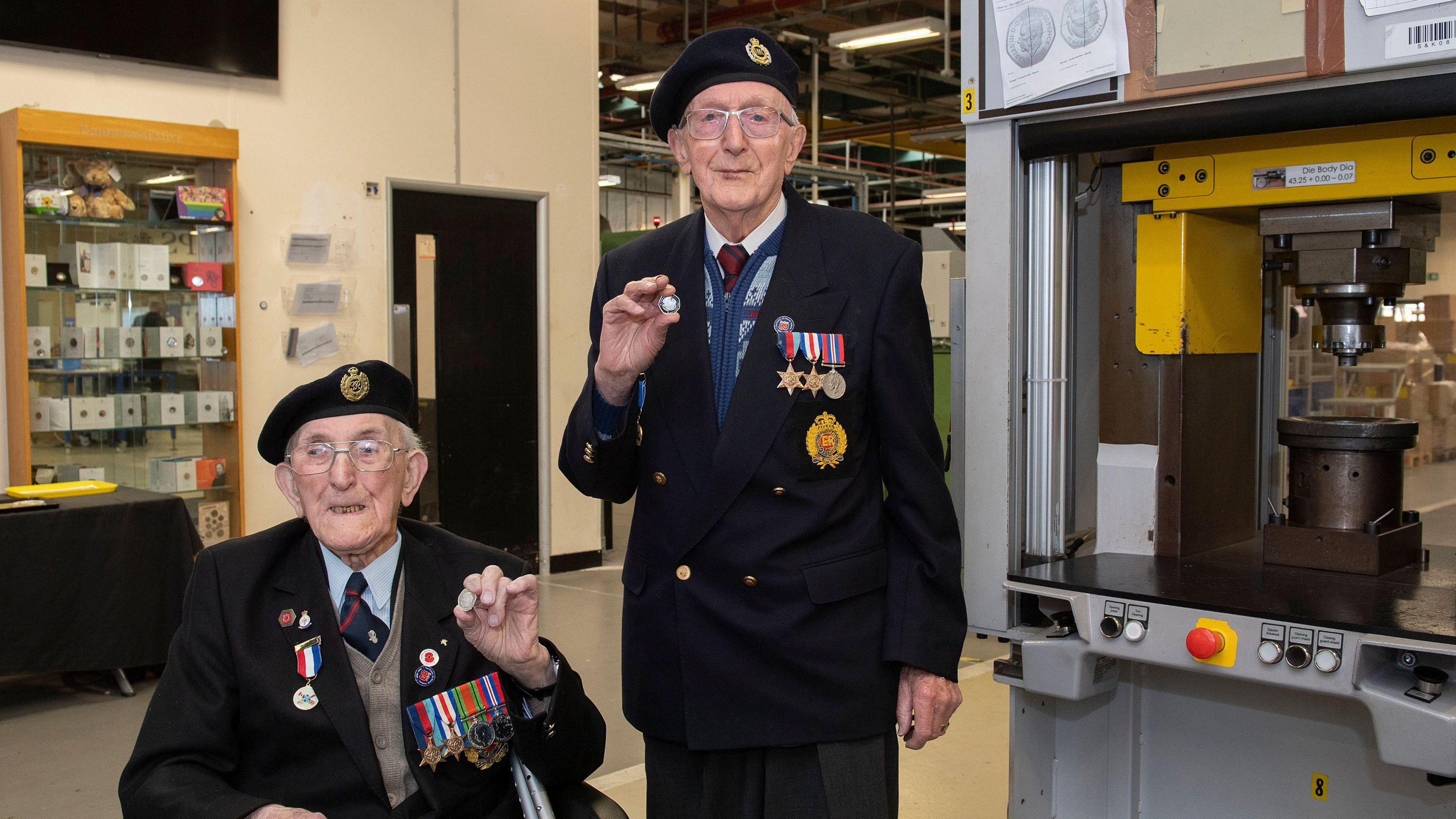 Richard Pelzer (left) and Ron Horsey (right), from Swansea, were among the first to strike the new VE Day coins.