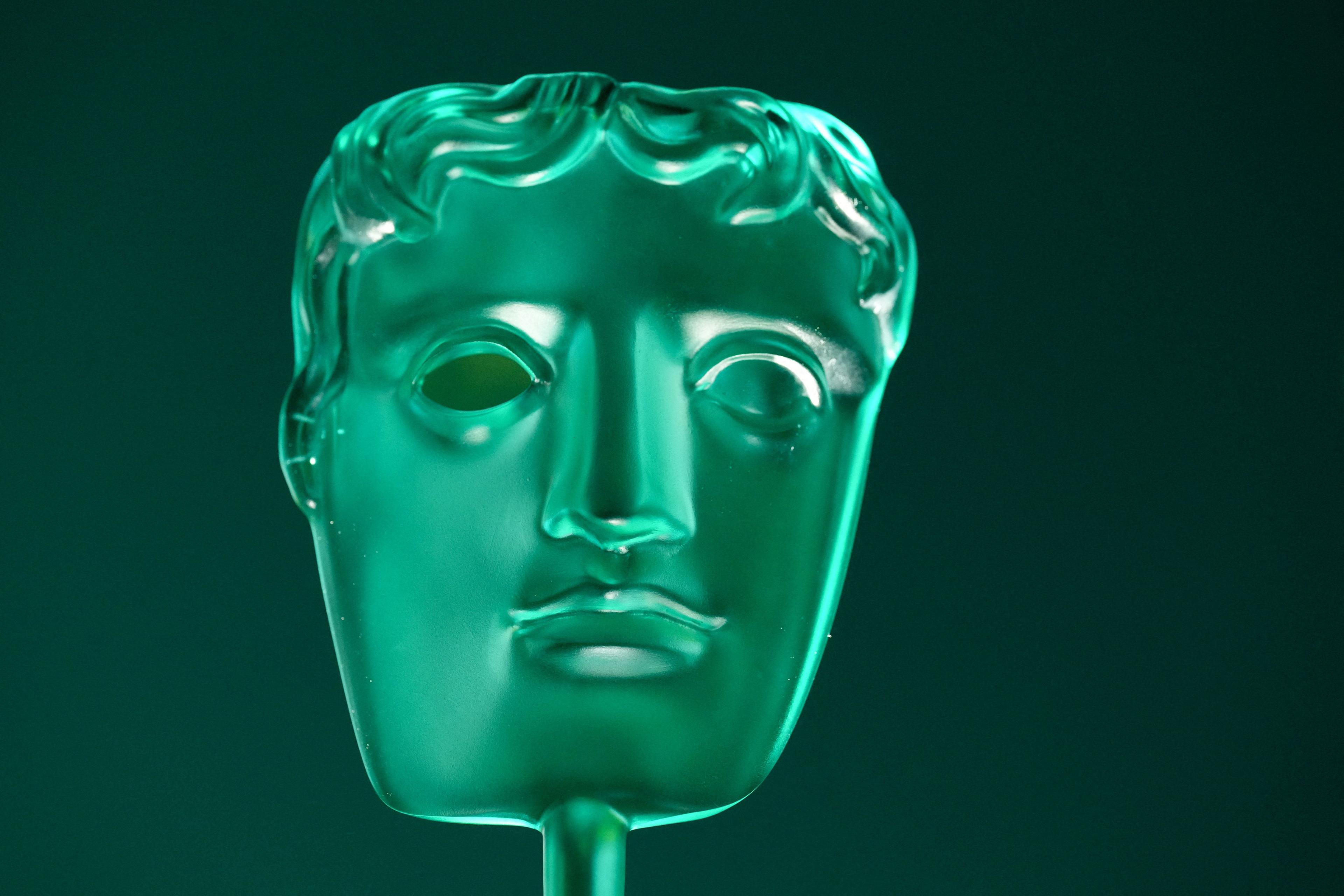 A green Bafta Rising Star Award trophy - of a generic face 