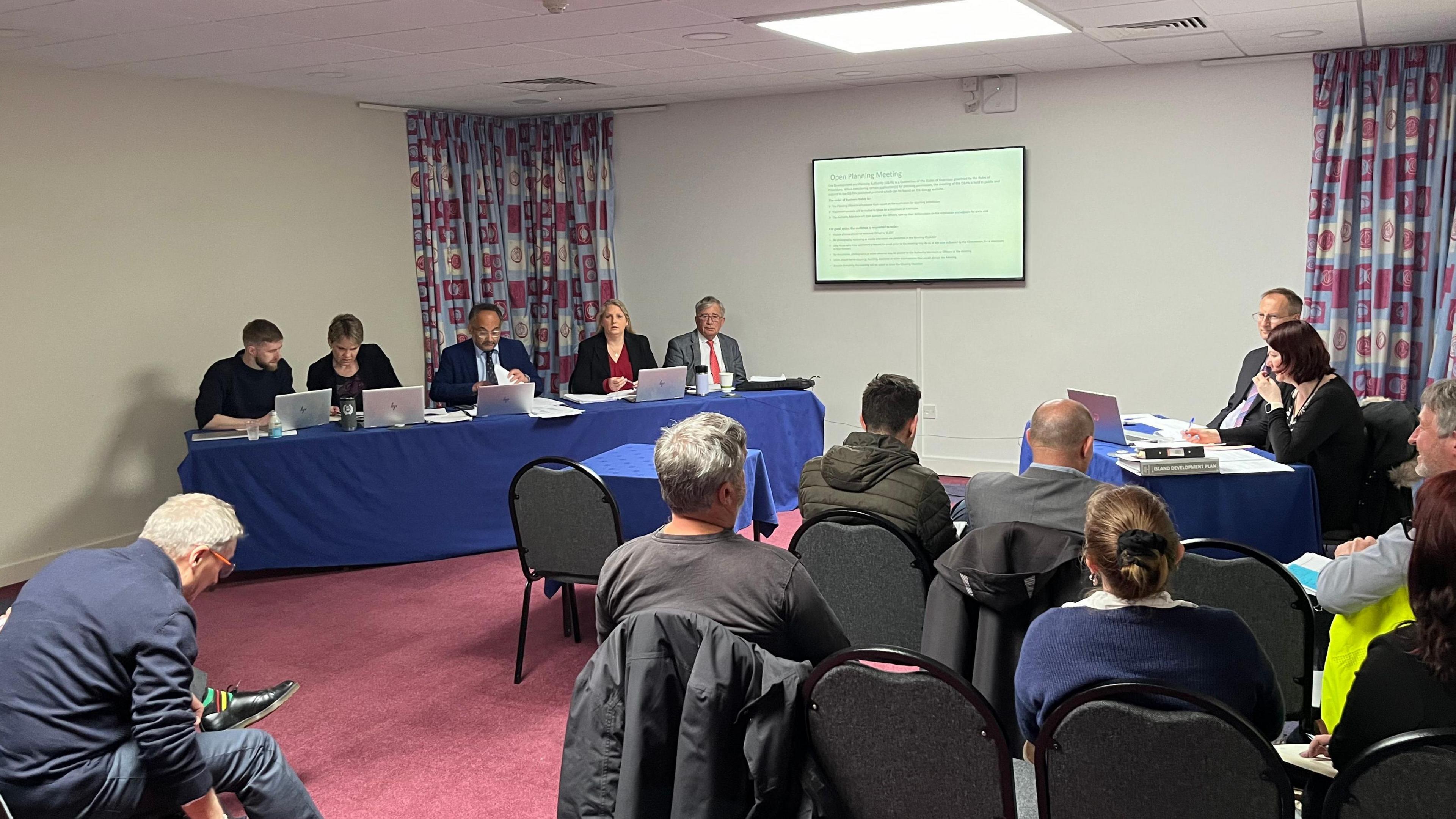 The five members of the Development and Planning Authority at an Open Planning Meeting at Beau Sejour