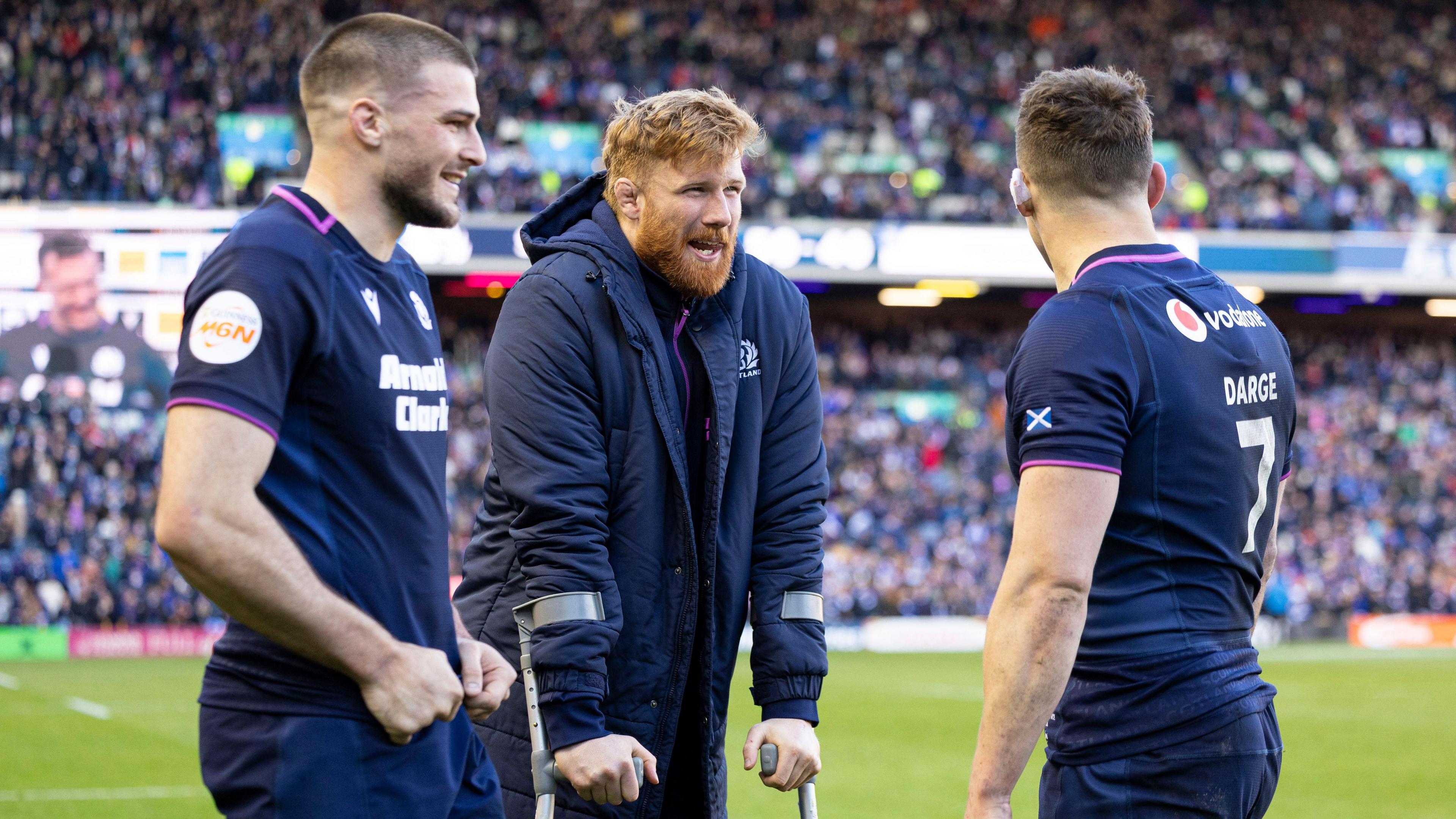 Josh Bayliss, Gregor Brown and Rory Darge chat after Scotland's Six Nations victory against France