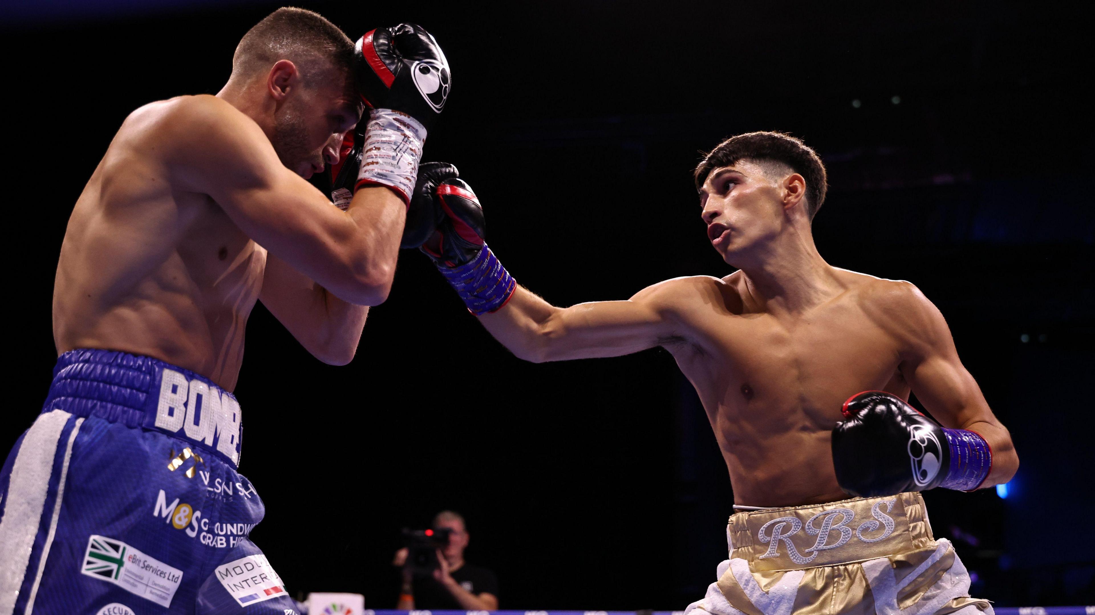 Royston Barney-Smith (right) throws a punch at Reece Bellotti 